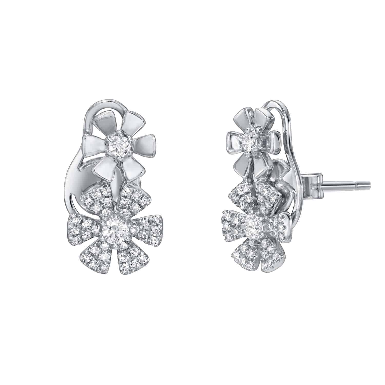 Double Diamond Flower Earrings — These elegant silver earrings feature two intricately encrusted diamond floral motifs, sparkling beautifully against a white background. For jewelry inquiries or to explore custom options, discover the timeless elegance of Janet Heller fine jewelry.
