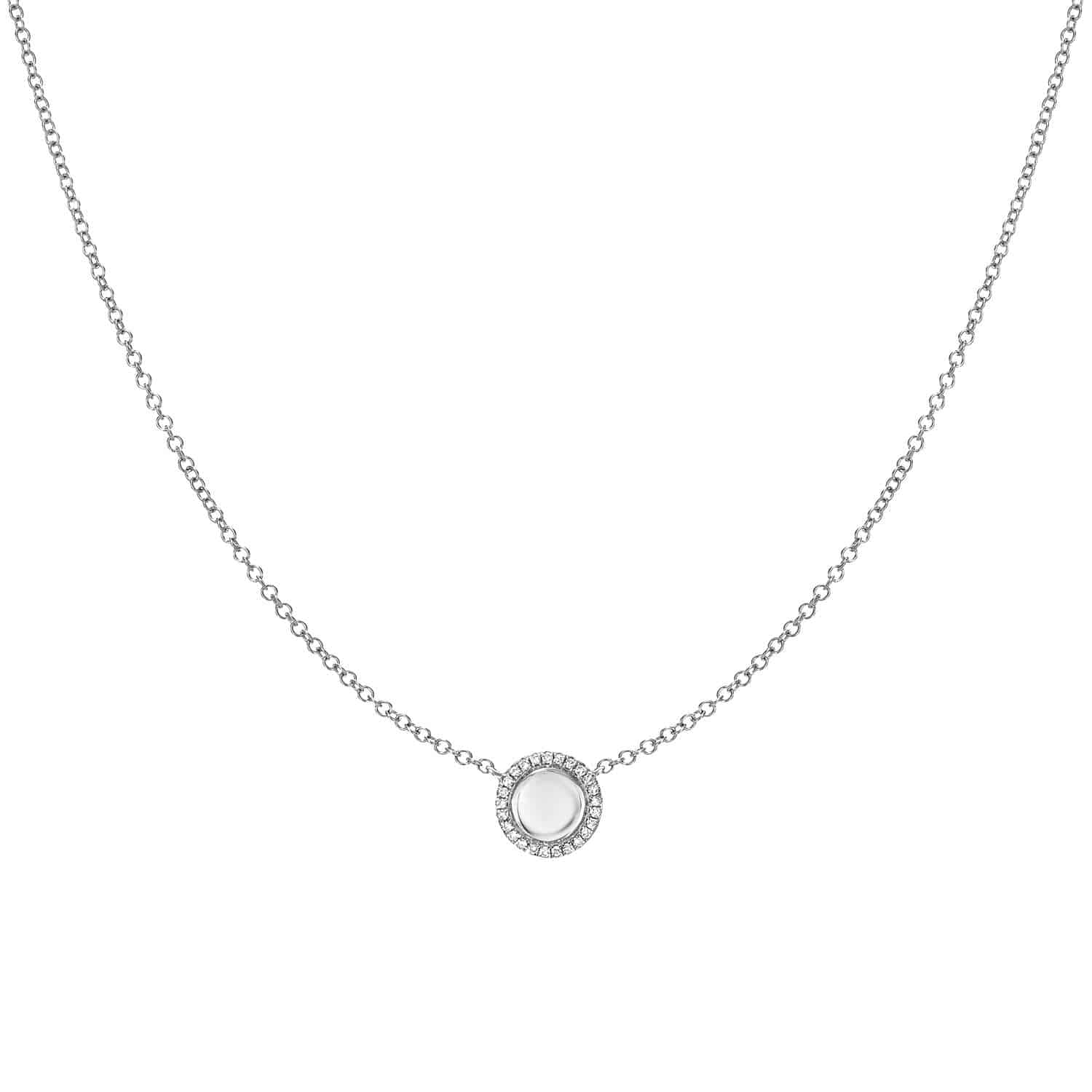 The Engravable Kennedy Necklace features a delicate silver chain and a round pendant adorned with a central white gemstone, encircled by shimmering stones. This beautiful piece offers personalized jewelry customization, allowing you to add your own engraving for a truly unique keepsake.