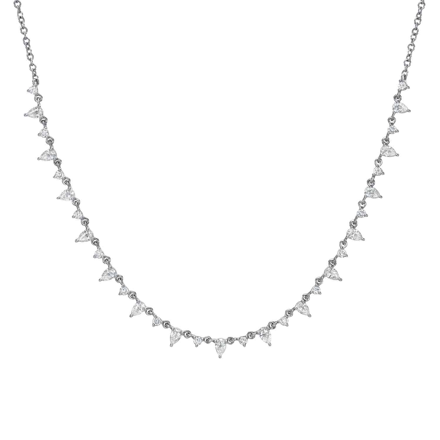 The Pear Shaped Diamond Necklace is a silver chain adorned with evenly spaced triangular pendants, each featuring a clear gemstone that creates a sparkling effect. This elegant piece allows for customizations to enhance its sophisticated design.