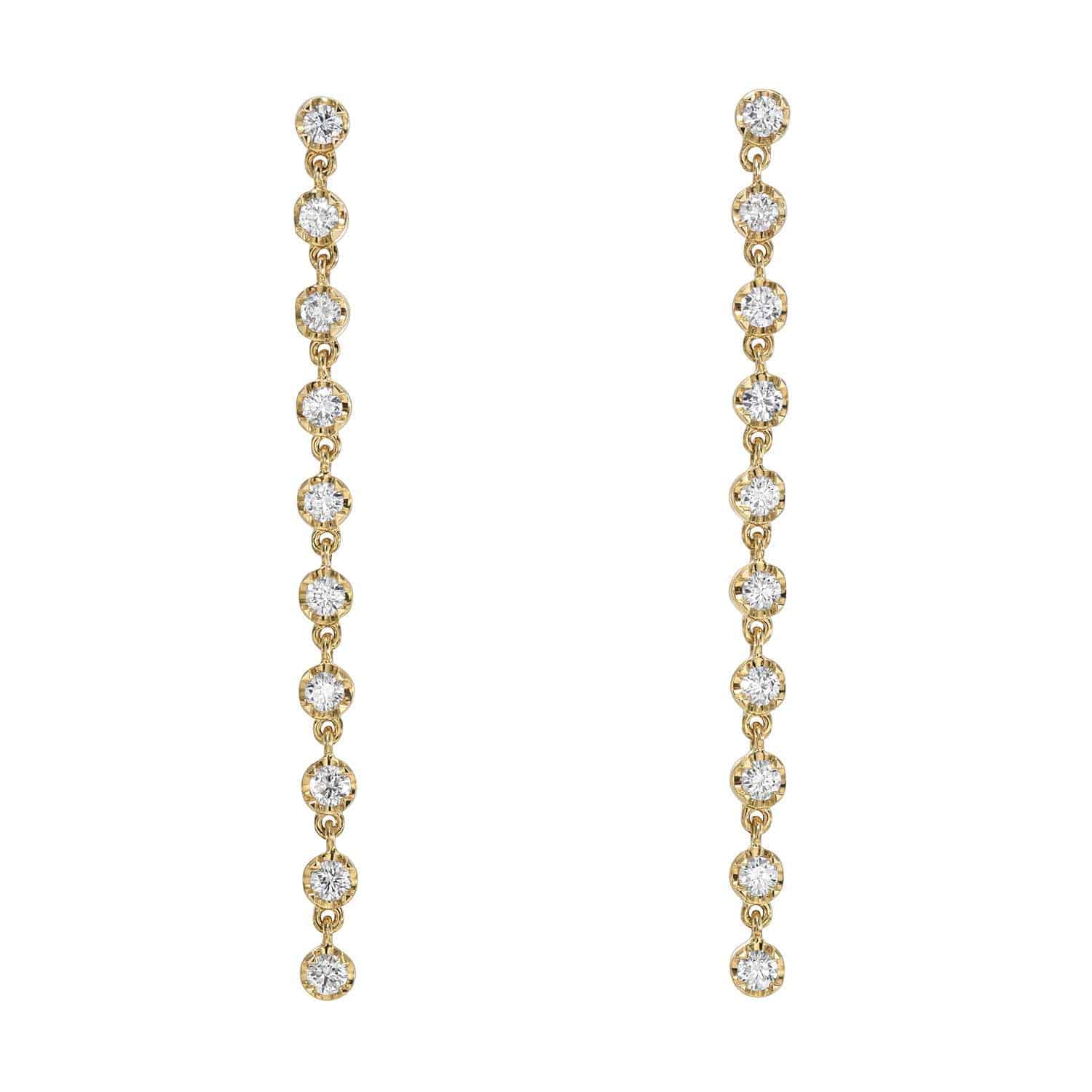 Explore the sophistication of Janet Heller fine jewelry with the 10 Drop Diamond Reagan Earrings. These gold drop earrings feature a vertical line of round diamonds in circular settings, forming an elegant chain. The symmetrical design offers customizable options for your perfect look.