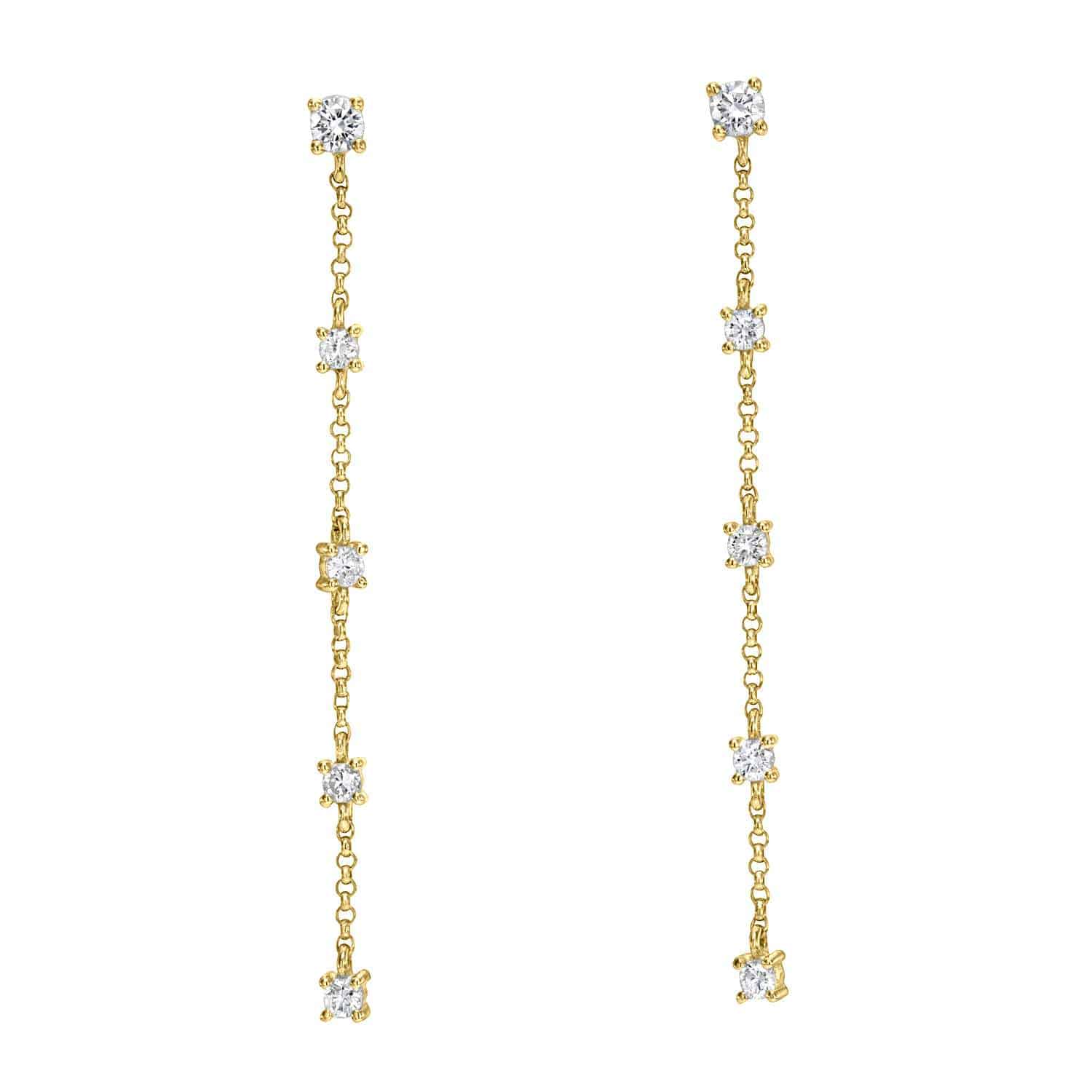 Introducing the 5 Drop Diamond Finley Earrings: exquisite gold chain drop earrings adorned with five meticulously spaced diamond-like stones on each chain, crafted to perfection, offering a delicate and elegant appearance throughout.