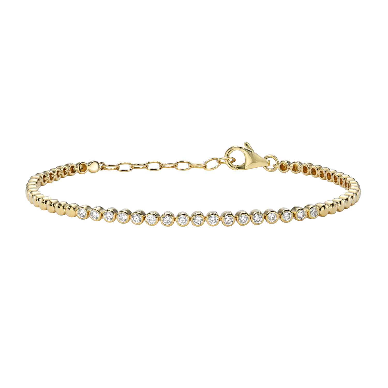 The Bezel Diamond Beaded Bracelet from Janet Heller Fine Jewelry is crafted in 14KT gold and features 17 bezel set diamonds on a beaded chain. The bracelet can be worn alone or stacked with other bracelets.