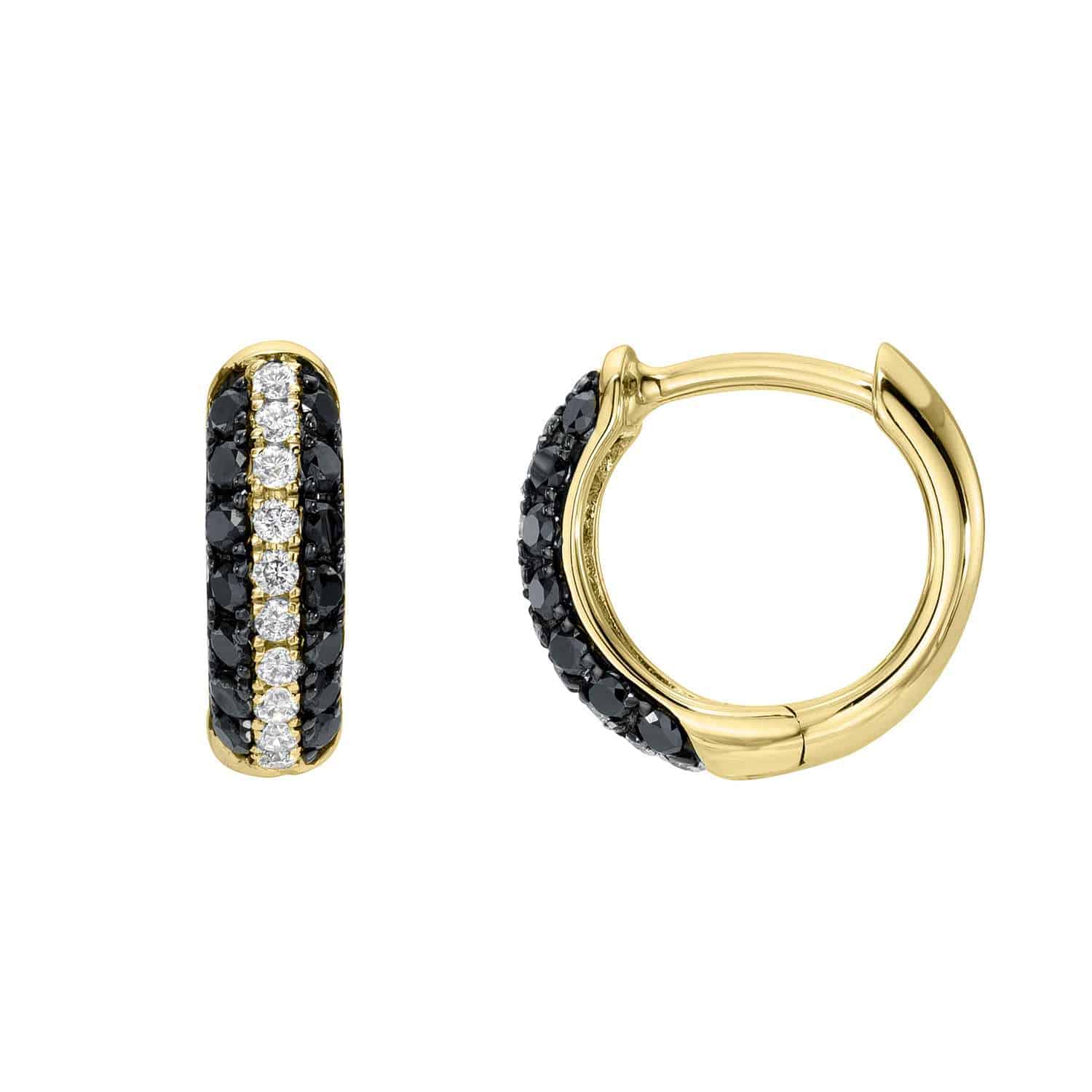 The Black & White Diamond Huggies showcase exquisite jewelry craftsmanship with gold frames adorned with alternating black and white gemstones; one earring displays its front, while the other elegantly reveals its side clasp.