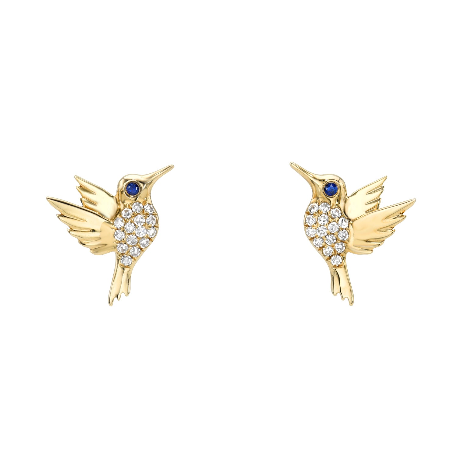 The Blue Sapphire & Diamond Hummingbird Studs by Janet Heller Fine Jewelry showcase two exquisite gold, hummingbird-shaped designs with small sparkling stones and a blue sapphire eye. The birds are gracefully poised, facing each other with outstretched wings.
