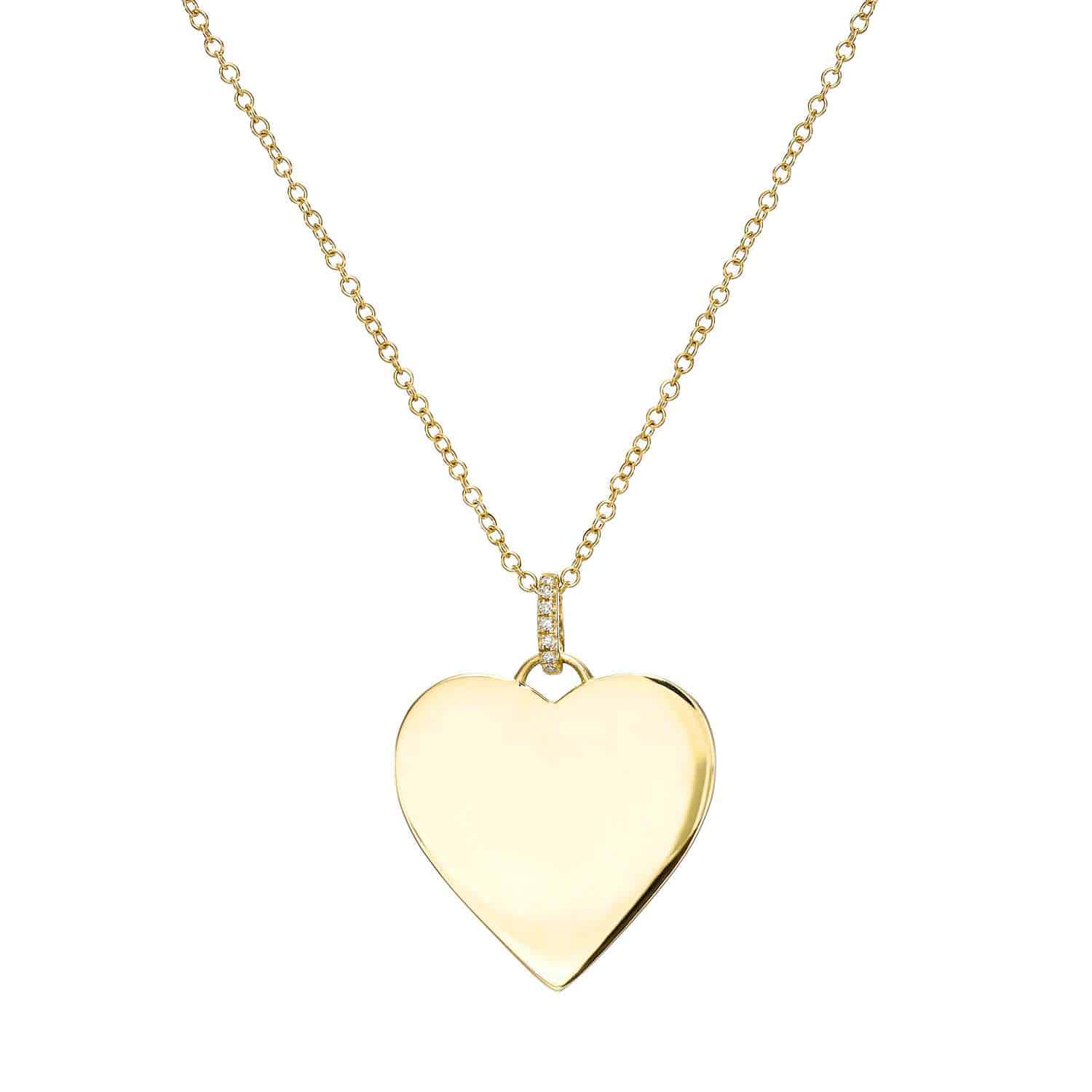 The Brinley Necklace is a gold piece featuring a delicate chain and a shiny, smooth heart-shaped pendant—perfect for custom jewelry lovers and ideal for optional engraving.