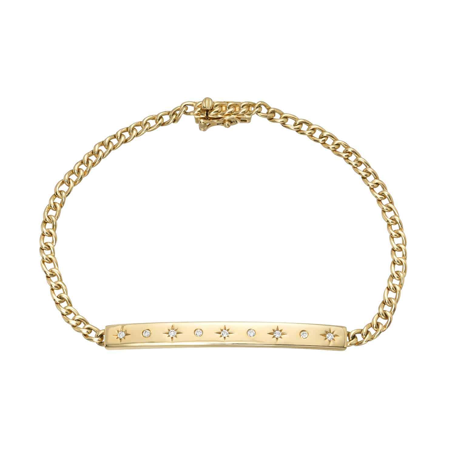 A timeless piece from Janet Heller Fine Jewelry, the Cuban Link Star Bar Bracelet features a gold chain and a rectangular bar adorned with delicate star-shaped engravings, each sparkling with a tiny gemstone.