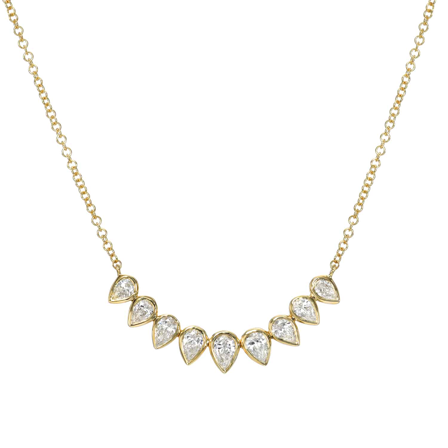 The Curved Pear Diamond Necklace from Janet Heller Fine Jewelry is crafted in 14KT gold.  The necklace is adorned with pear-shaped diamond pendants on an elegant chain.  The necklace can be worn alone or layered with other chains.