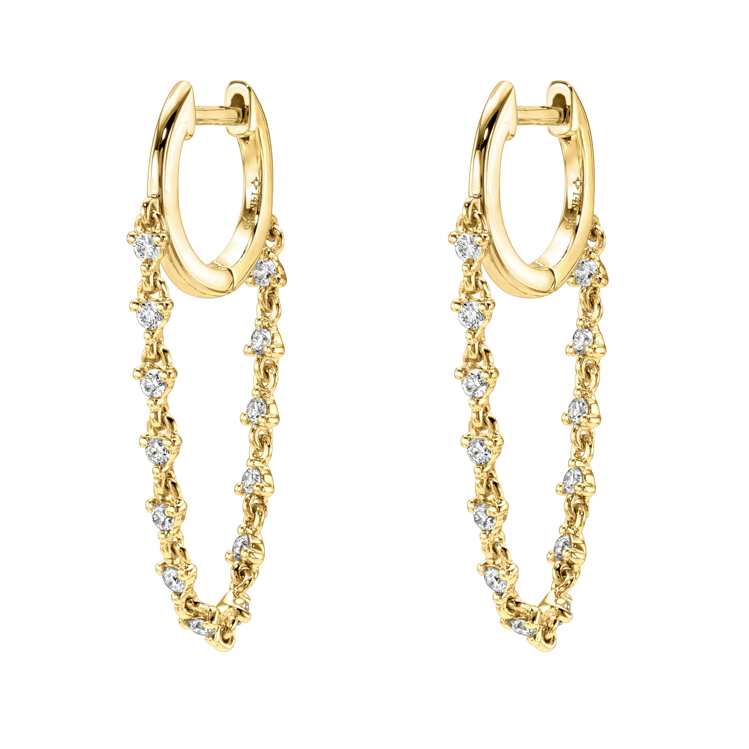 The Diamond Cascade Drop Huggies from Janet Heller Fine Jewelry are crafted in 14KT gold. The dangling hoop earrings feature evenly spaced round diamonds connected by a delicate chain. The earrings can be worn alone or layered along the ear with other earrings.