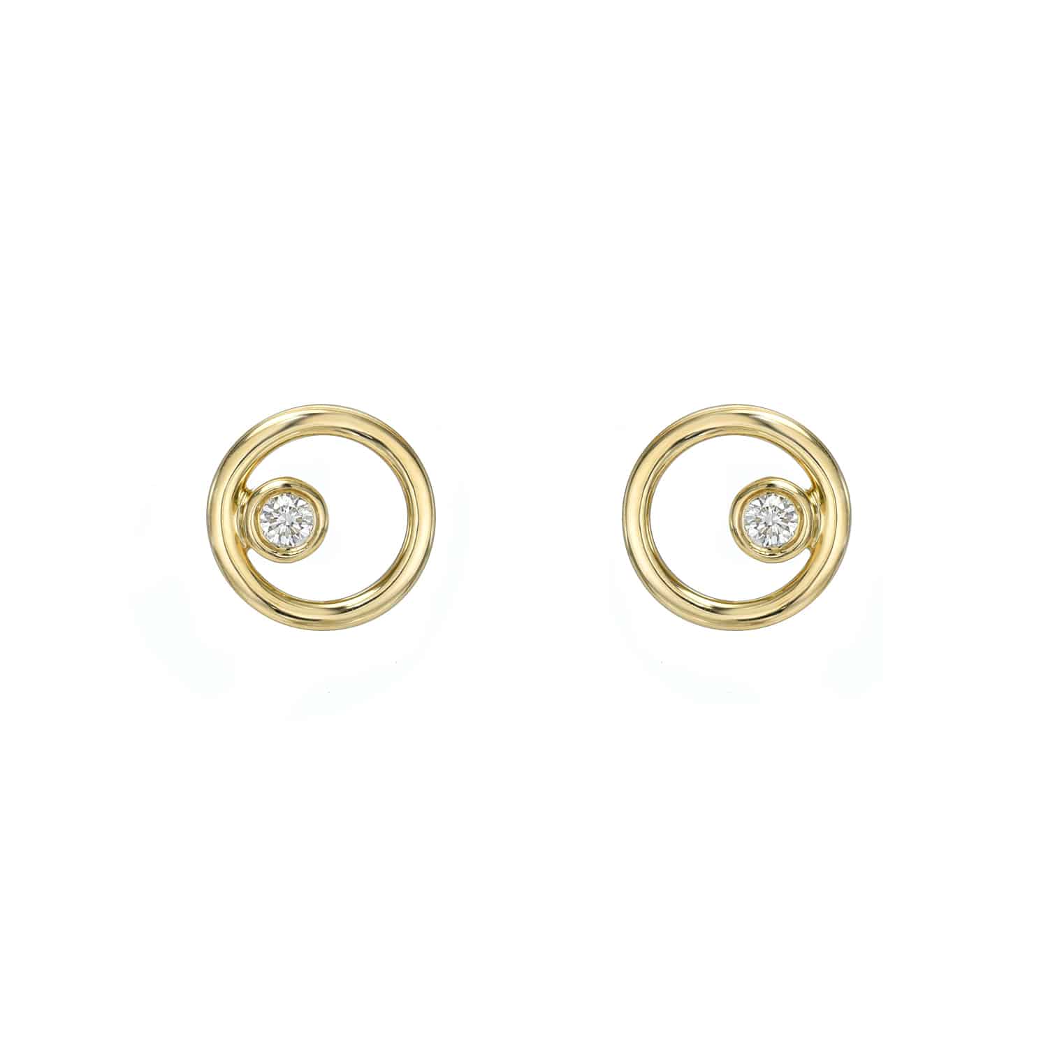 Discover Janet Heller Fine Jewelrys Diamond Circle Stud Earrings. These circular gold earrings feature a small central diamond on each earring, designed with an elegant and minimalist style to emphasize the simplicity and brilliance of the materials.
