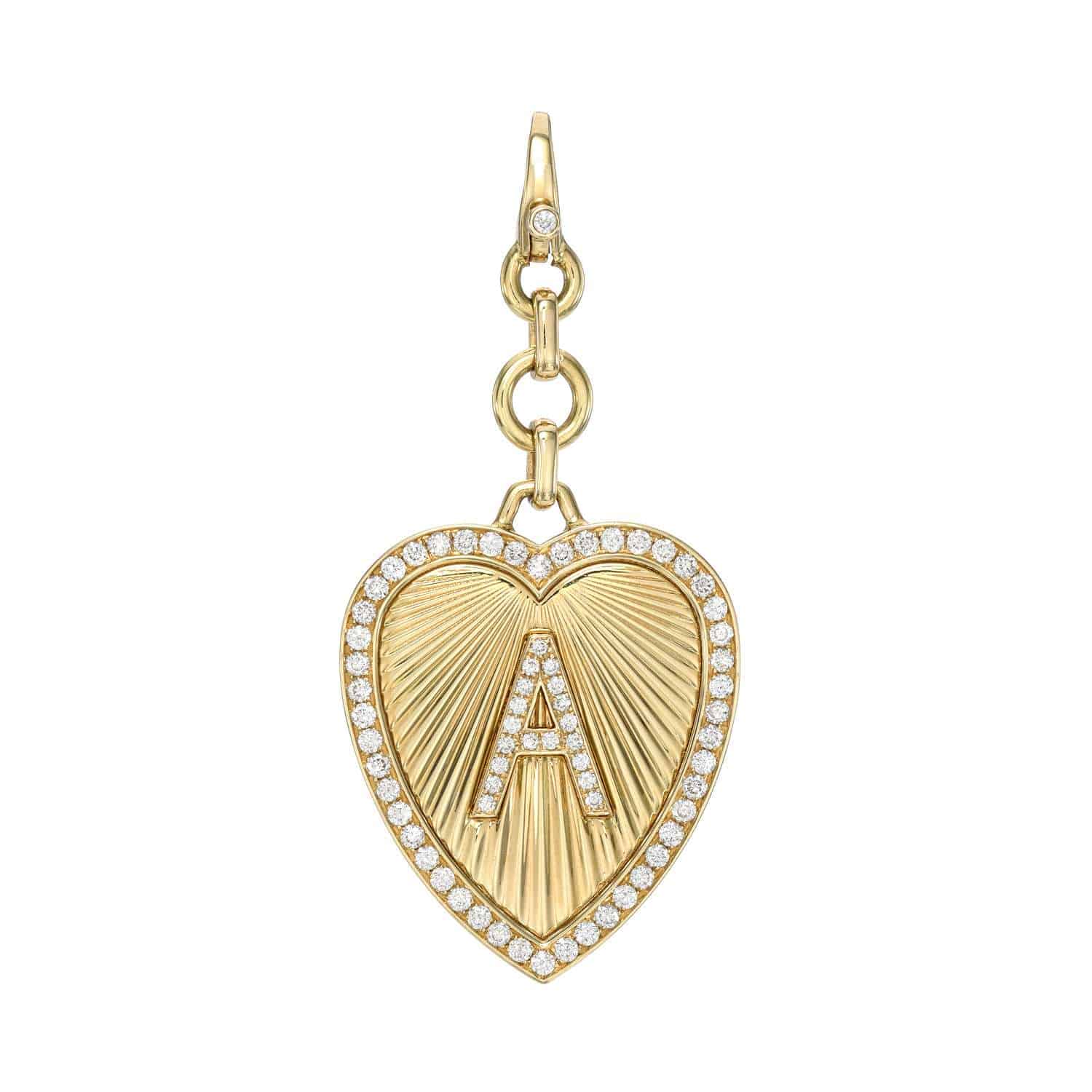 The Diamond Heart Initial Teagan Charm from Janet Heller Fine Jewelry is crafted in 14KT gold. This gold heart-shaped pendant showcases a sunburst design with a diamond-studded letter of your choice, bordered by diamonds. The clasp clips easily onto various Janet Heller Fine Jewelry chains and necklaces.