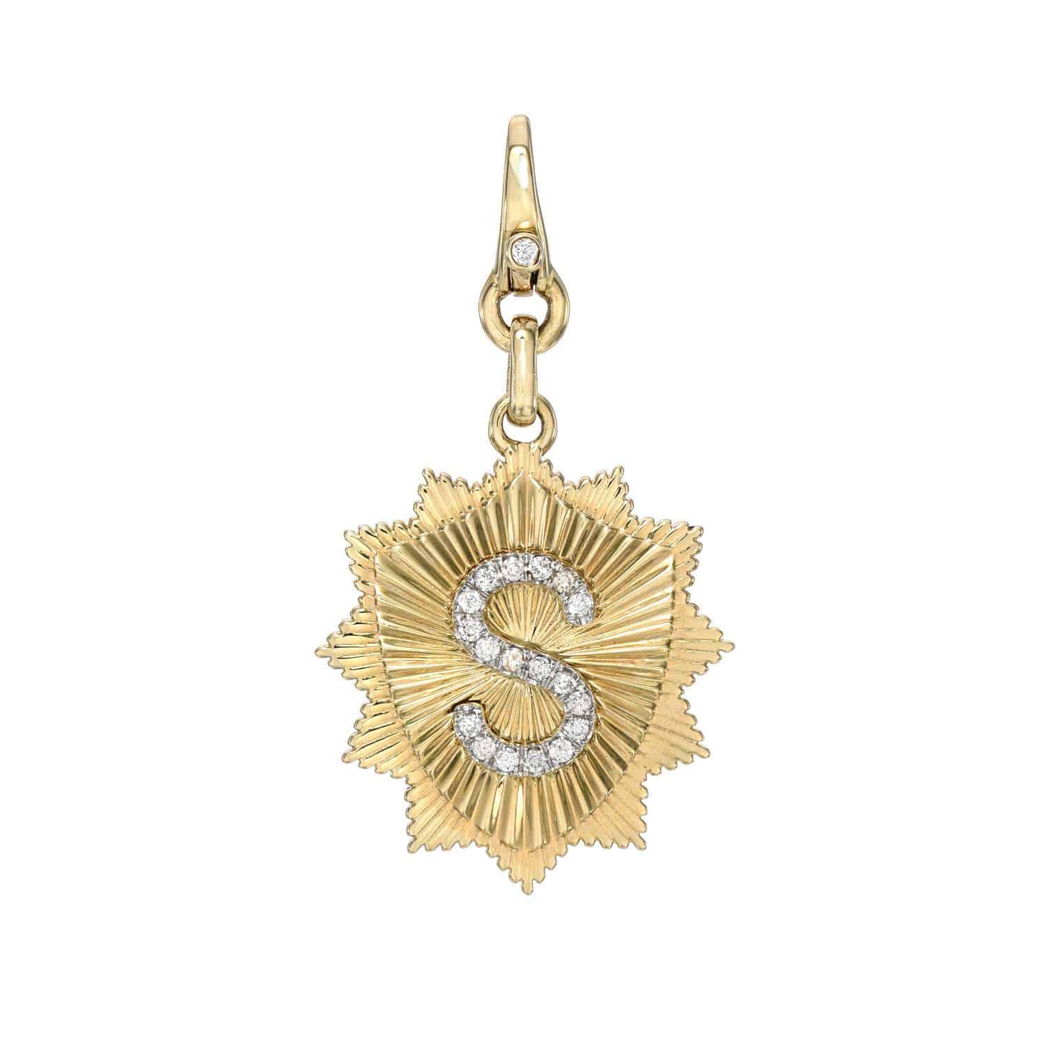 The Diamond Initial Shiloh Charm by Janet Heller Fine Jewelry features an exquisite starburst with a diamond-encrusted S and a clasp adorned with a charming diamond.