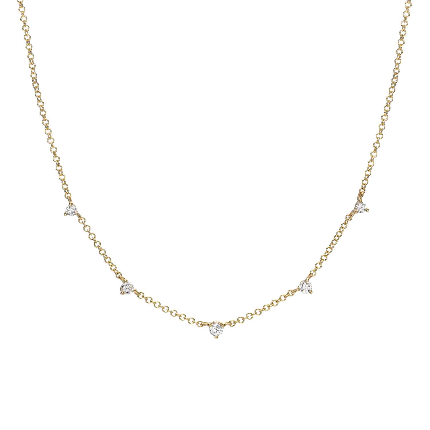 The Diamond Luna Necklace by Janet Heller Fine Jewelry is a delicate gold chain adorned with evenly spaced small diamond accents, adding subtle elegance and sparkle.
