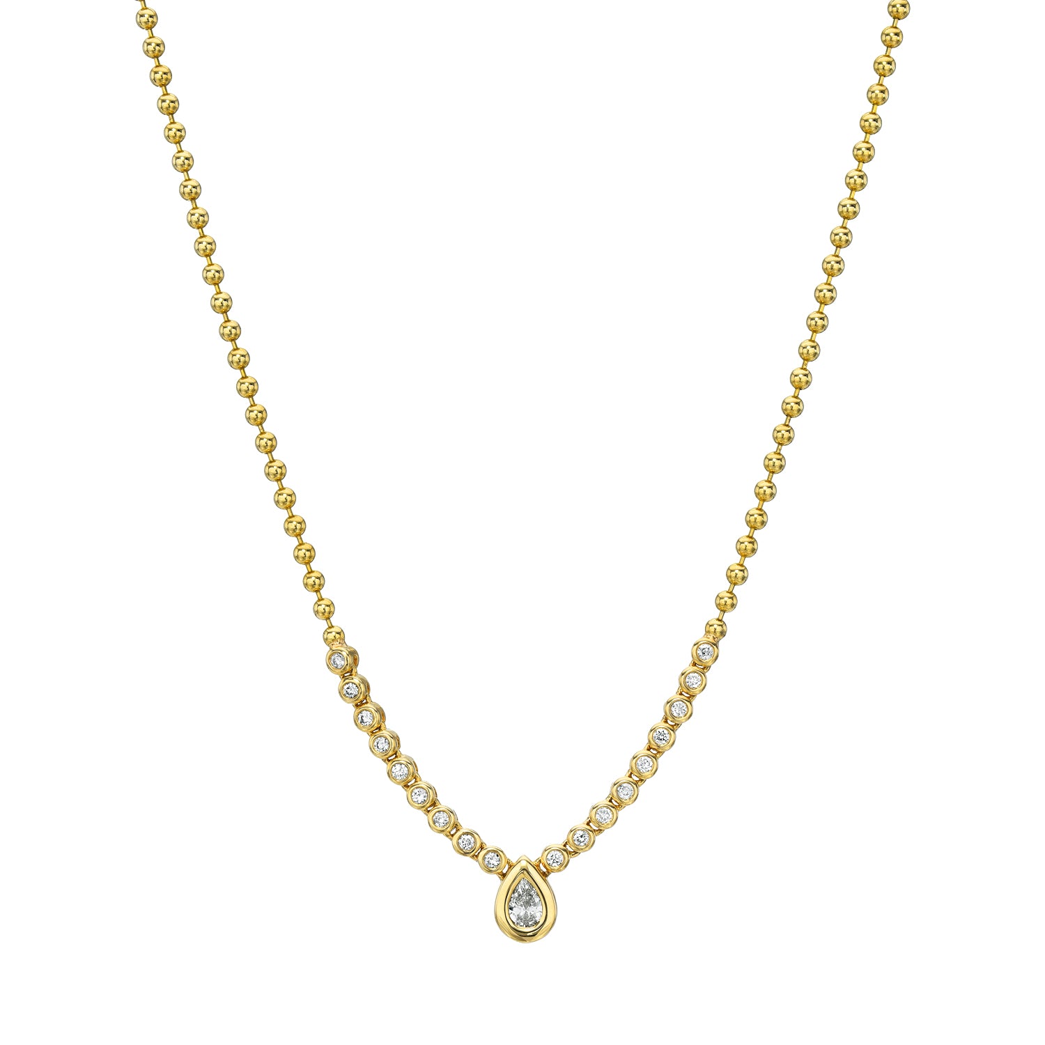 The Diamond Pear Bezel Necklace from Janet Heller Fine Jewelry is crafted in 14KT gold.  The necklace features a teardrop-shaped pendant with small diamonds and a graduated round gold bead chain.  The necklace can be worn alone or layered with other chains.