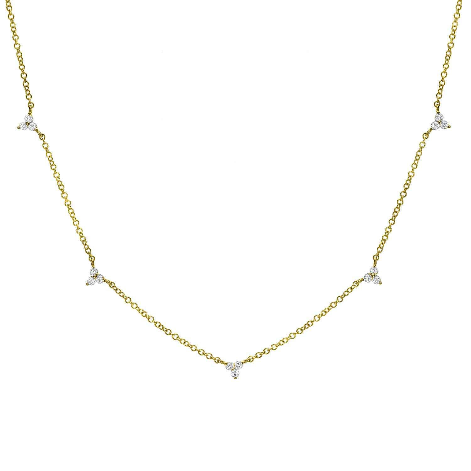 Explore the elegance of the Diamond Penelope Necklace by JanetHellerFineJewelry, showcasing clusters of three clear gemstones symmetrically spaced along a gold chain. This minimalist piece offers timeless beauty with customization options to match your style.