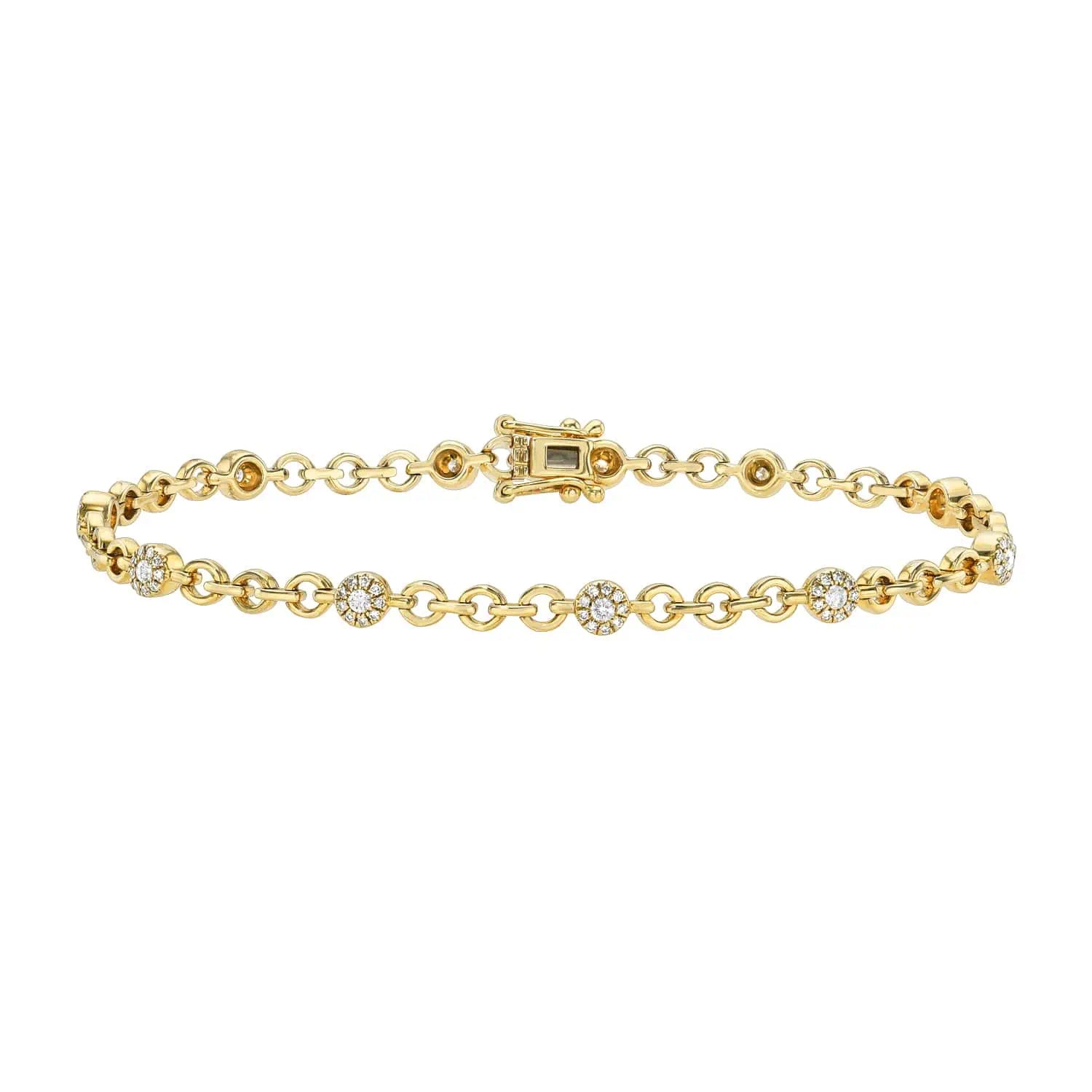 The Diamond Round Link Bracelet is an exquisite piece, featuring a delicate gold chain and small round diamond clusters. Its ornate clasp matches the gold hue, offering a subtle elegant shine with customizable options to suit your style.