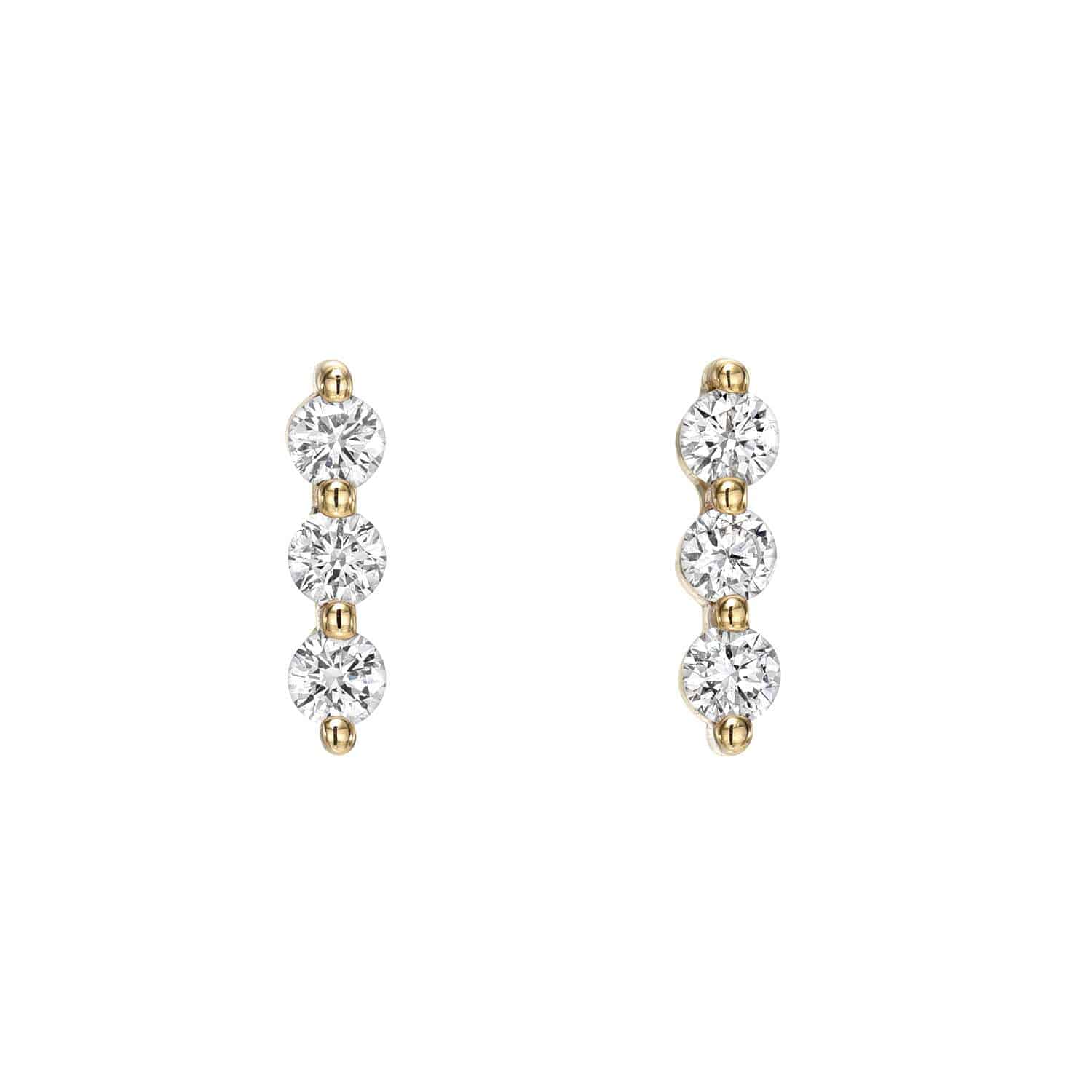 Explore the elegance of Diamond Trio Bar Studs, featuring three vertically aligned round diamonds in each earring, at Janet Heller Fine Jewelry. Customize these exquisite gold earrings for a timeless and unique touch to your collection.
