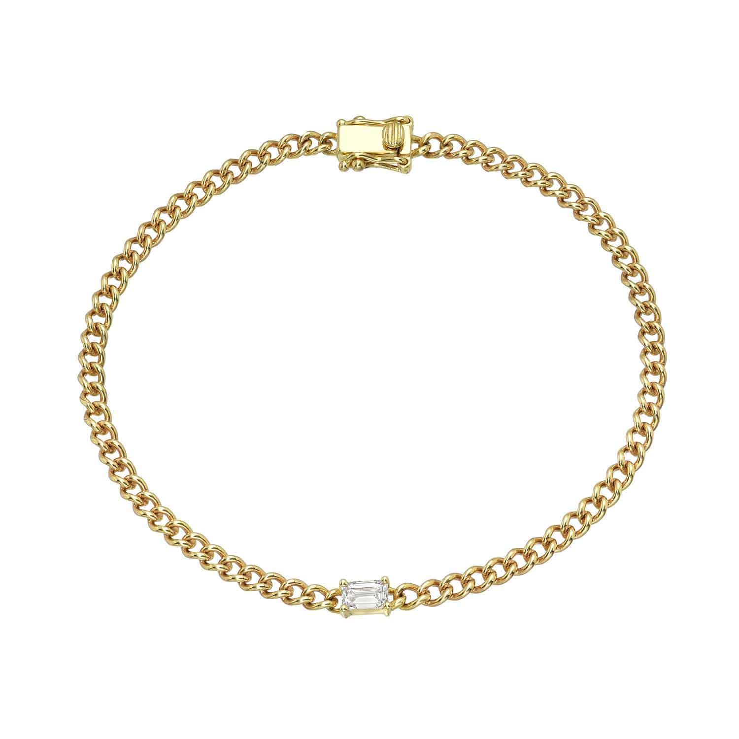 Emerald Cut Aurora Bracelet featuring a single rectangular clear gemstone set at the center of a gold chain, displayed on a white background.