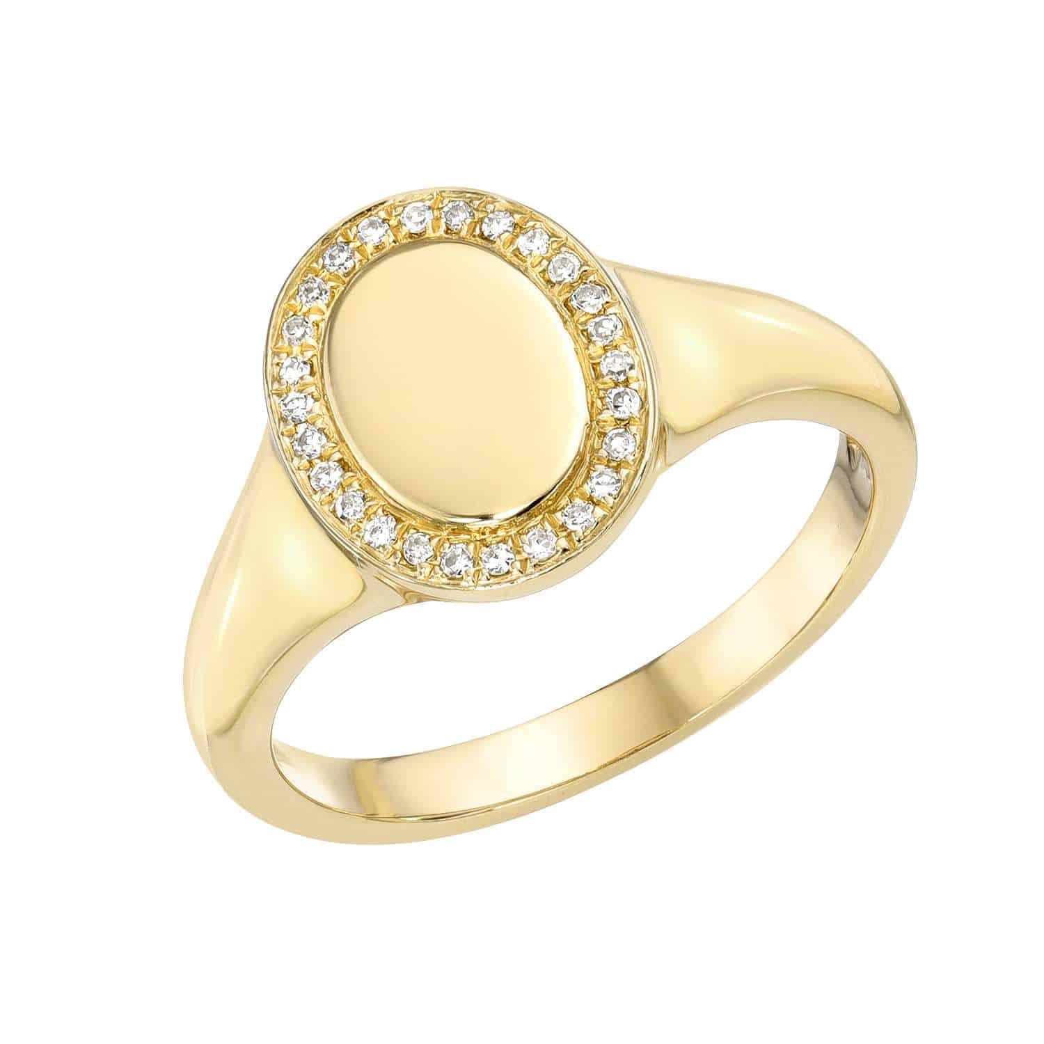 The Engravable Freya Ring showcases an oval-shaped top bordered by sparkling white gemstones, offering a design that is both elegant and shiny, capturing light beautifully.