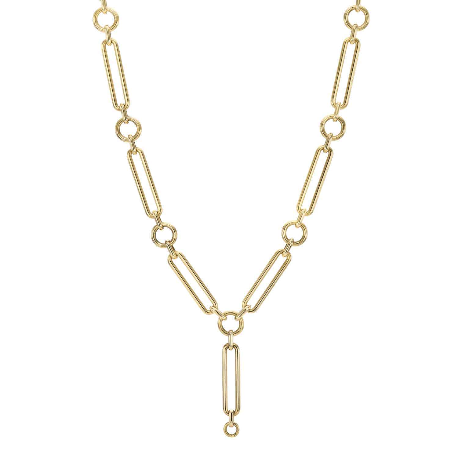 Experience the elegance of the Ivy Chain from Janet Heller Fine Jewelry. This gold chain necklace features elongated rectangular links joined by small circular ones, creating a symmetrical pattern with a unique dangling link at the center, enhancing any outfits charm.
