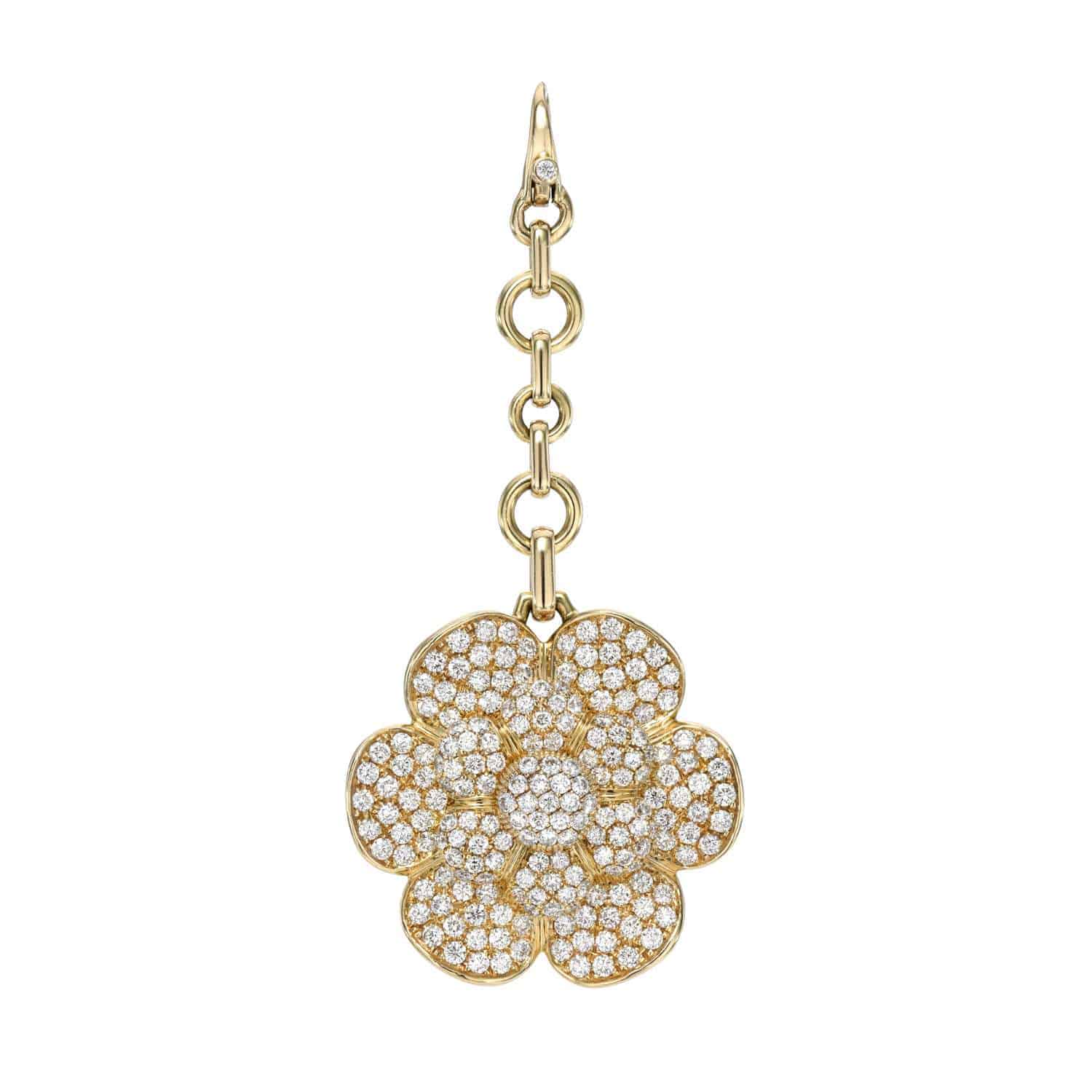 The Janet Heller Fine Jewelry collection features the Large Diamond Flower Charm, a gold flower-shaped pendant encrusted with sparkling diamonds and suspended from gold chain links, with multiple intricate diamond-filled petals and a delicate clasp.