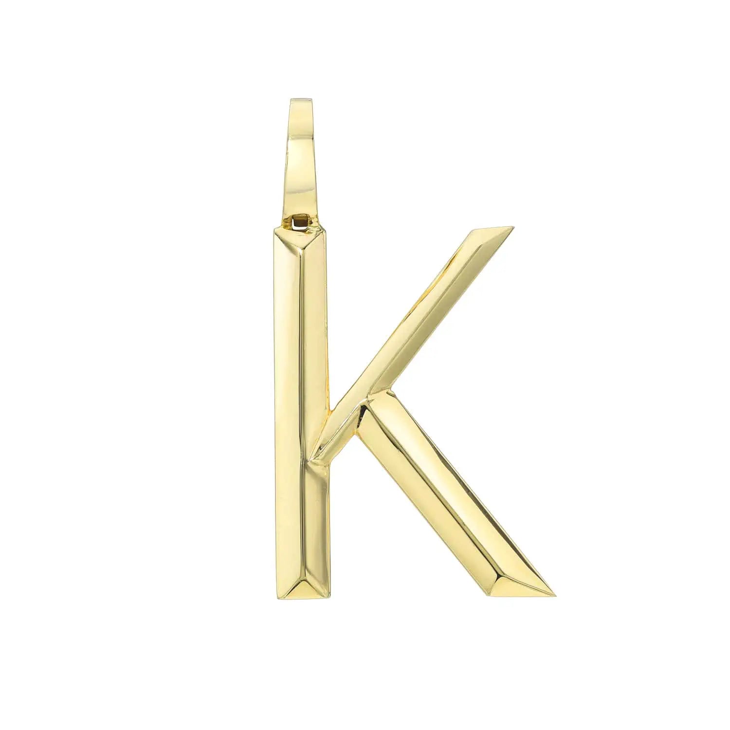 A gold K pendant from FoundryFineJewelry, designed like the Large Pyramid Initial Charm with a sleek, angular shape. It includes a top loop for easy chain attachment and has a smooth, reflective surface.