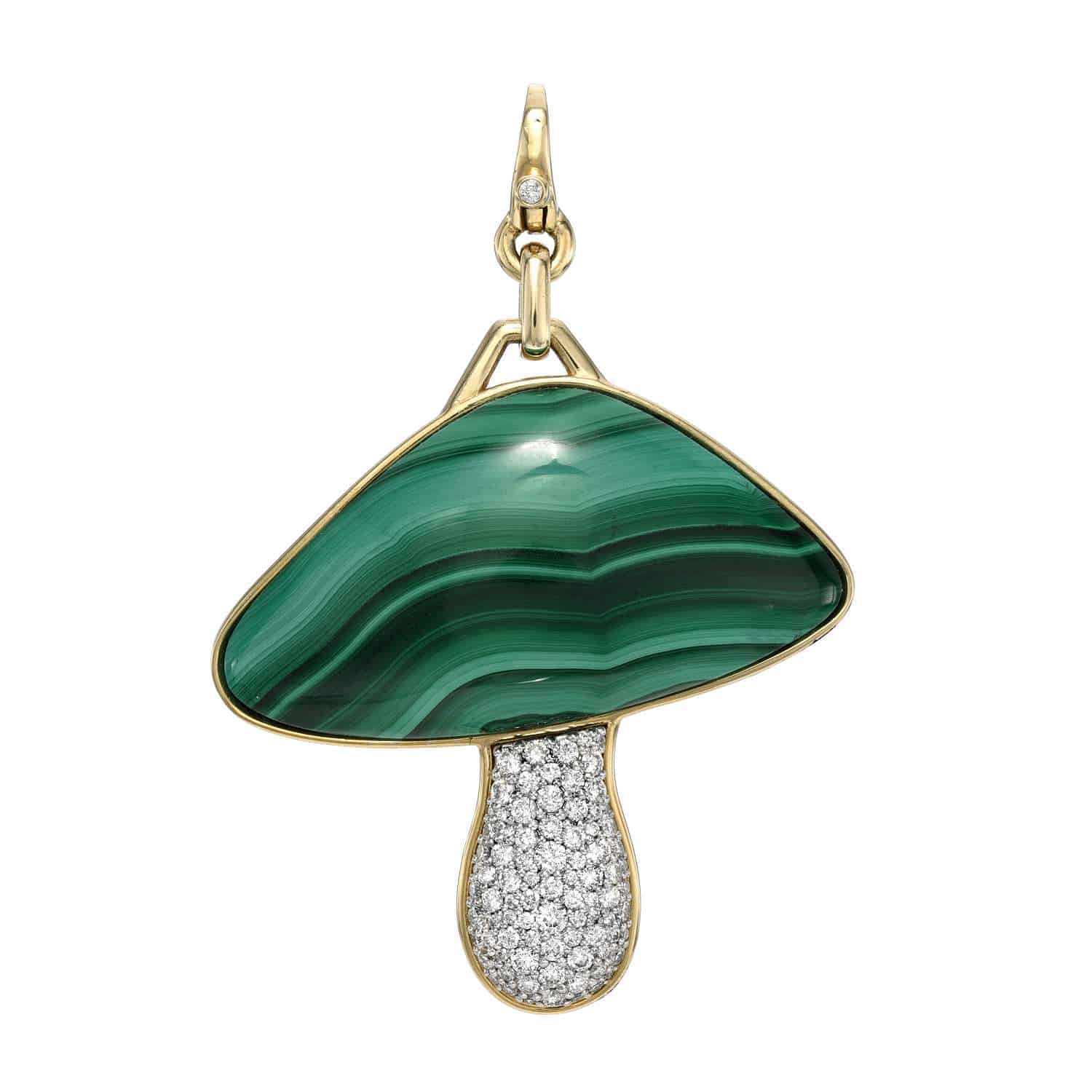 The Malachite Fungi Charm from Foundry Fine Jewelry is a charming mushroom-shaped pendant featuring a green malachite cap and a stem encrusted with sparkling stones, all set in a gold frame, plus a top loop for easy attachment to your necklace.