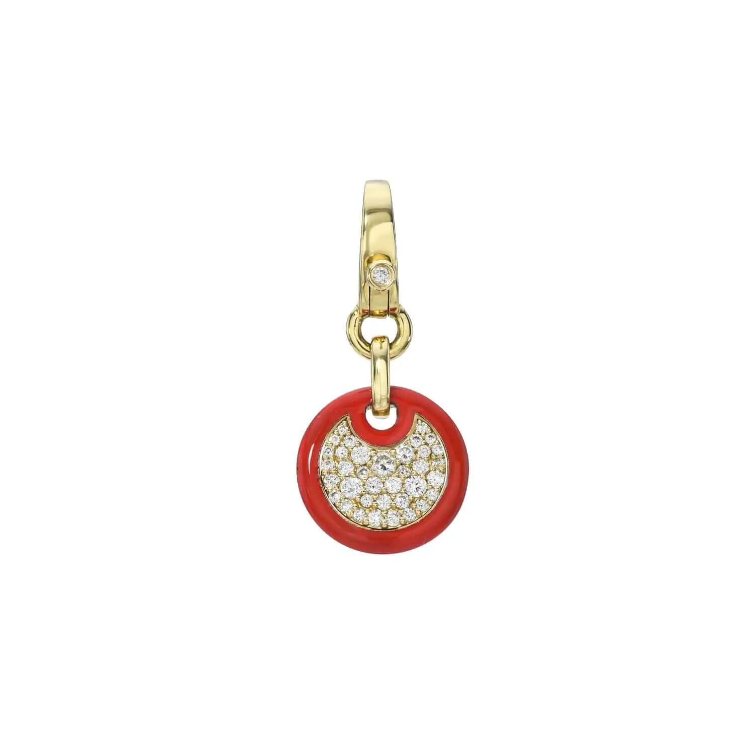 Explore the exquisite craftsmanship of Janet Heller Fine Jewelry with the Red Enamel Mini Round Diamond Charm, featuring a circular pendant with a red border. It showcases a crescent-shaped, diamond-encrusted design and offers customizations, complete with a gold clasp adorned by one diamond accent.