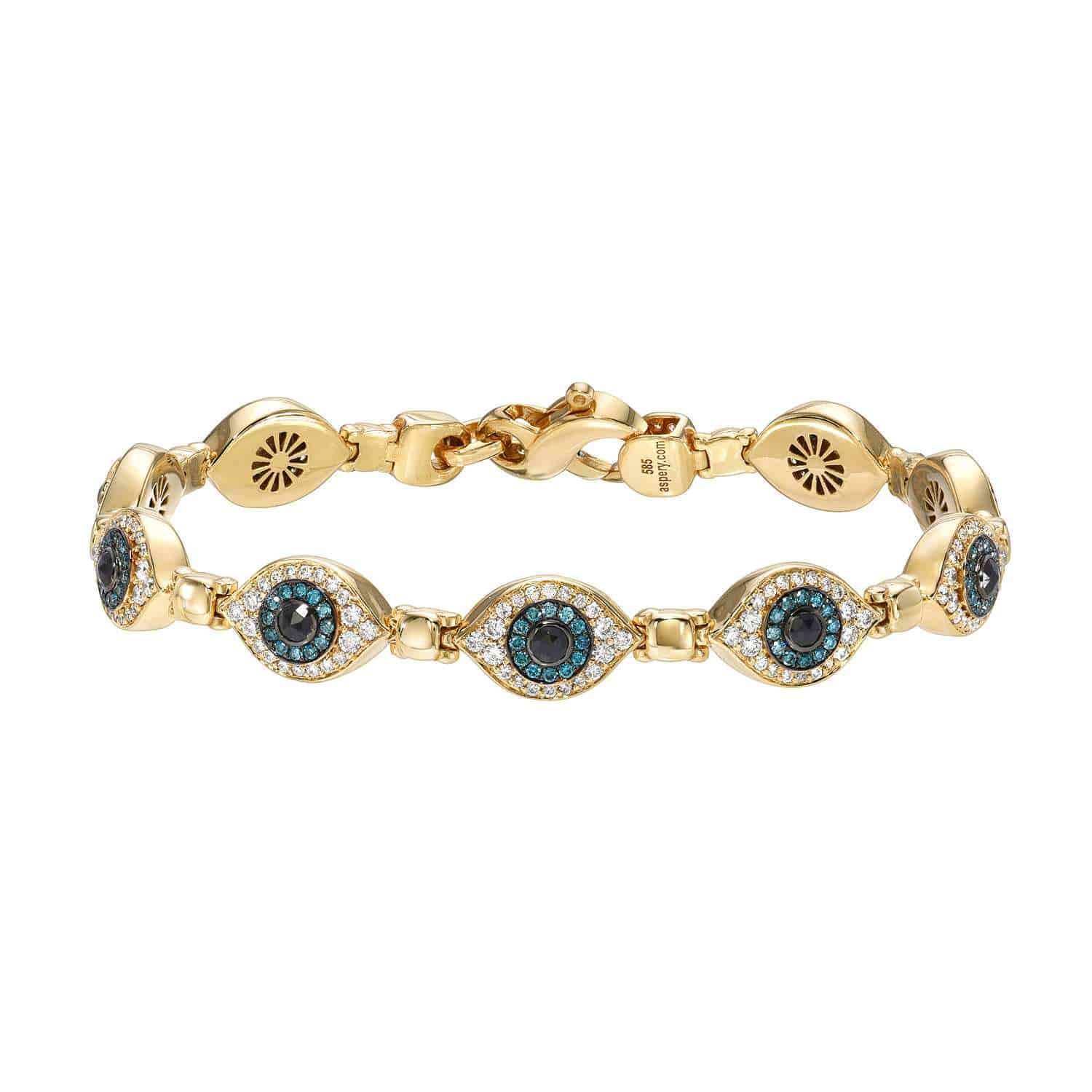 The Repeating Evil Eye Bracelet showcases gold eye-shaped links with deep blue and black center stones encircled by small clear stones. It offers customizations and features a secure, adjustable clasp. Explore more at janethellerfinejewelry.com.