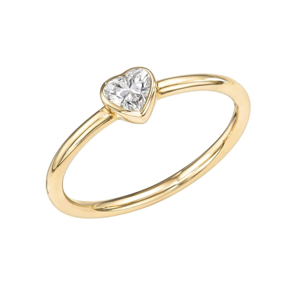 A delicate gold Solitaire Diamond Heart Pinkie Ring featuring a heart-shaped clear gemstone set at the center, photographed on a white background. This stunning piece from Janet Heller Fine Jewelry is available for preorder and can be customized to your preferred ring size.