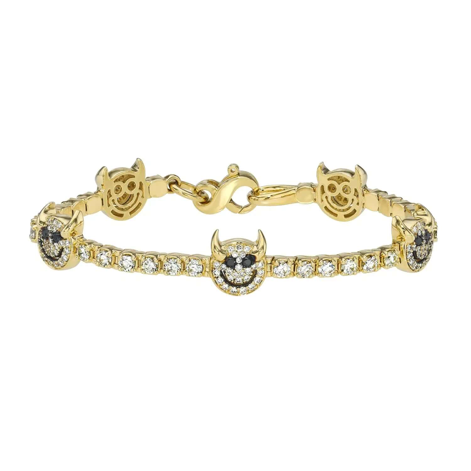 The Tricky Devil Tennis Bracelet from Janet Heller Fine Jewelry is crafted in 14KT gold.  The bracelet features black and white diamonds.  The bracelet can be worn alone or stacked with other bracelets.