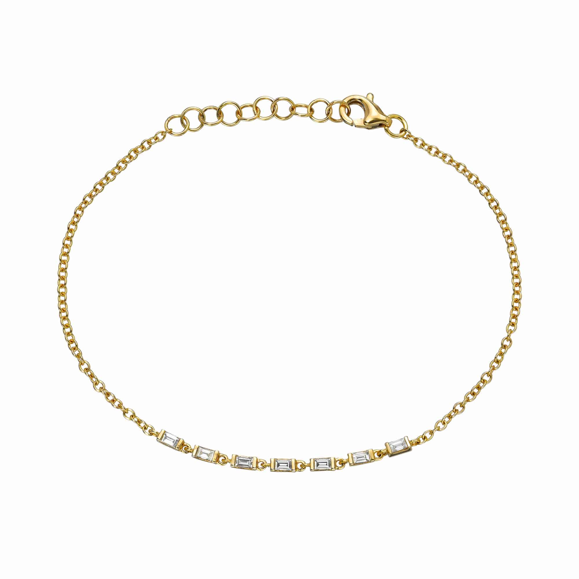 Explore the elegance of the Baguette Diamond Adda Bracelet from Janet Heller Fine Jewelry. This gold chain features small rectangular links with clear stones, a lobster clasp, and adjustable loops for subtle customization. Contact us to find your perfect fit today.