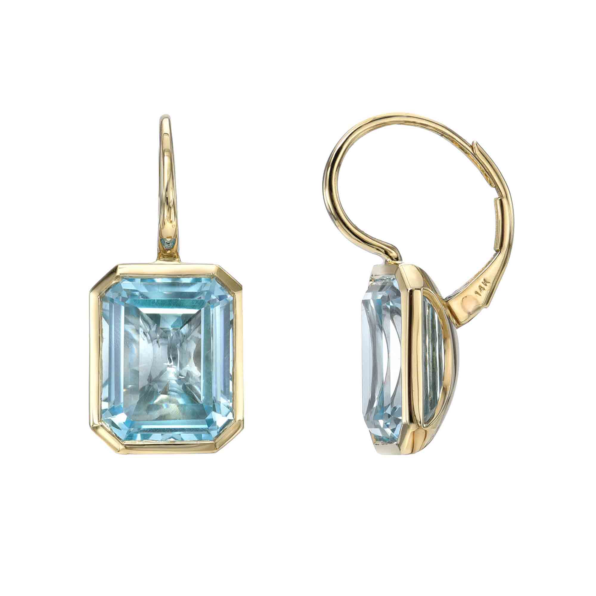 The Sky Blue Topaz Leverback Earrings from Janet Heller Fine Jewelry crafted in 14KT gold feature two blue topaz stones in an emerald-cut shape. The earrings can be worn alone or layered along the ear with other earrings.