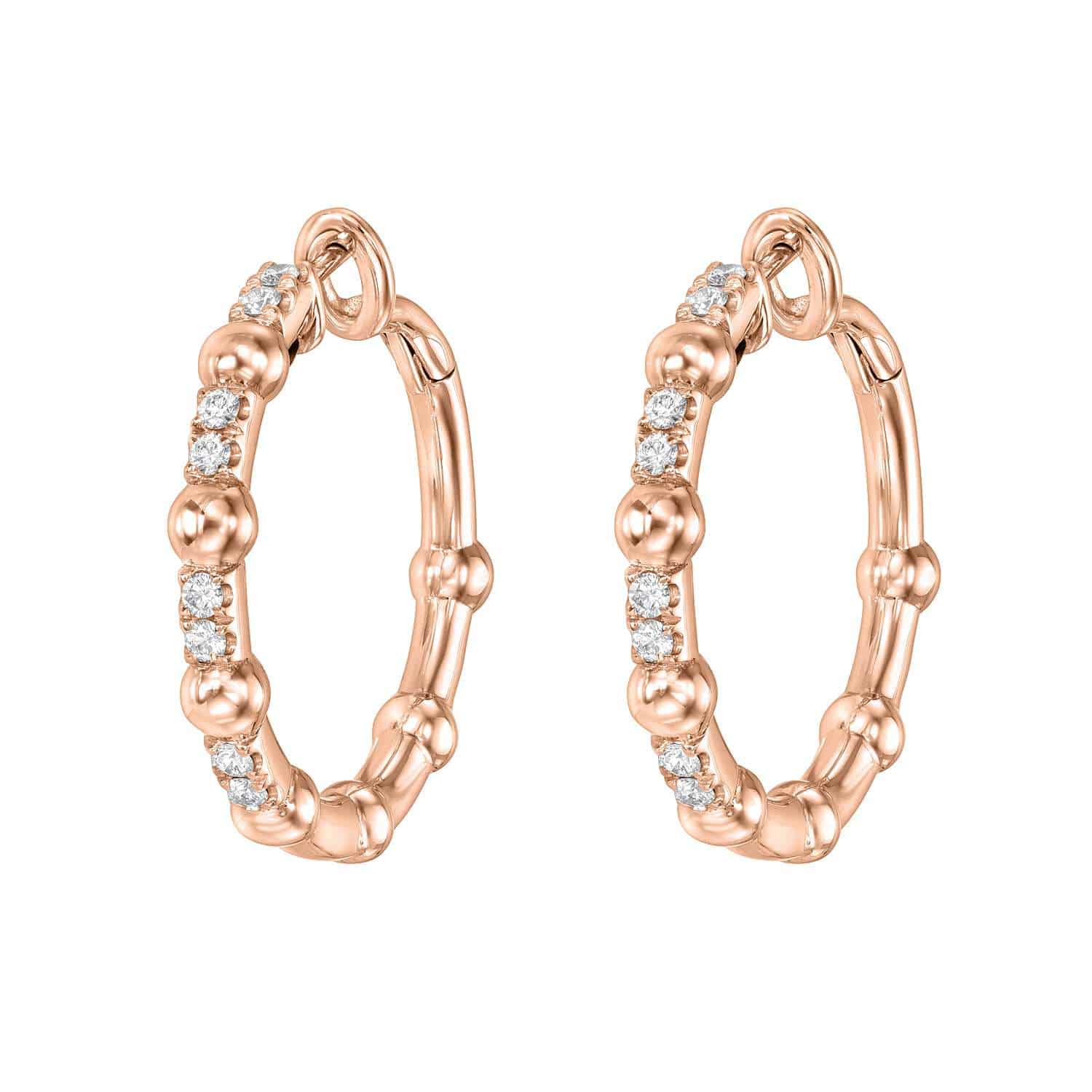 The Diamond Celeste Hoops from Janet Heller Fine Jewelry are crafted in rose gold and feature small, round diamonds set along the front, with decorative bead-like accents evenly spaced around each hoop—an exquisite addition to any fine jewelry collection.