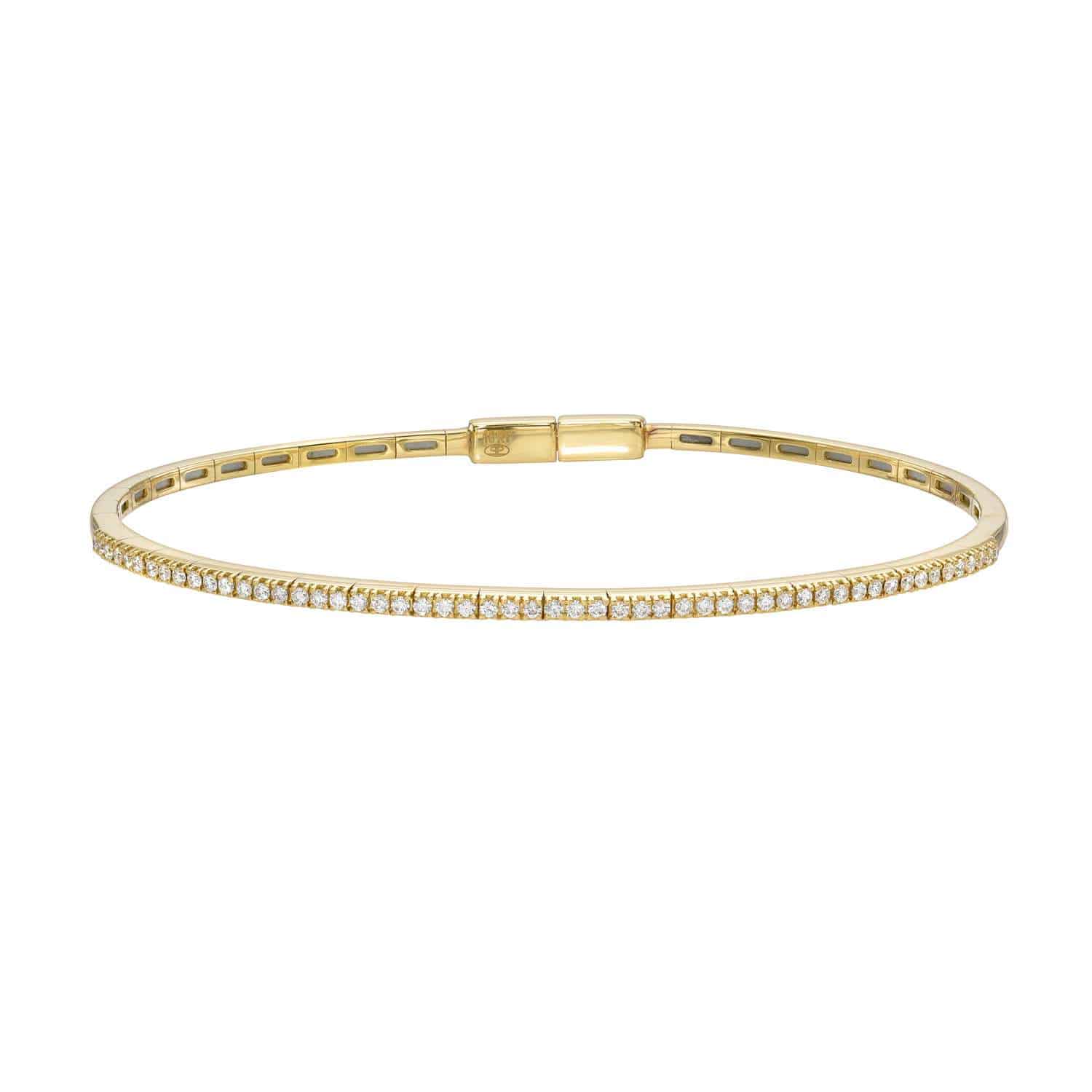The Diamond London Bangle is an elegant gold bracelet adorned with sparkling stones, showcasing fine jewelry craftsmanship. Its sleek, minimalistic design with a simple clasp ensures easy wear and offers customization to match your unique style.