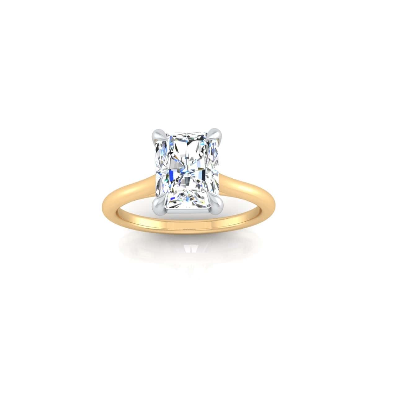 The Solitaire engagement ring in 18KT gold features a rectangle-cut diamond solitaire, set with four prongs. Expertly cut to reflect light, the diamond shines brilliantly against a plain white background.