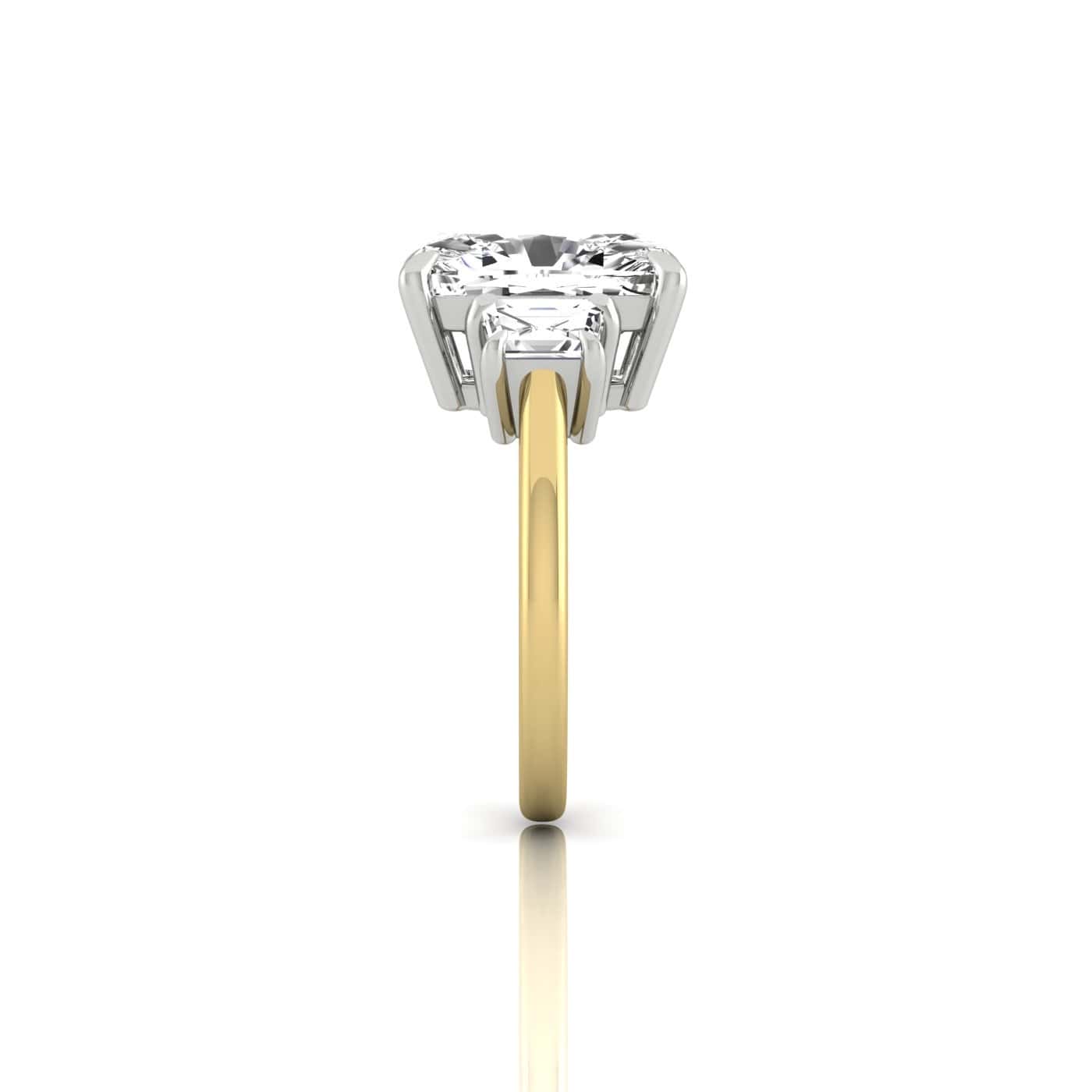 A side view of the Triad ring showcases a solitaire diamond centrally positioned in a triad setting on an 18KT polished gold band, softly reflecting on a white background.