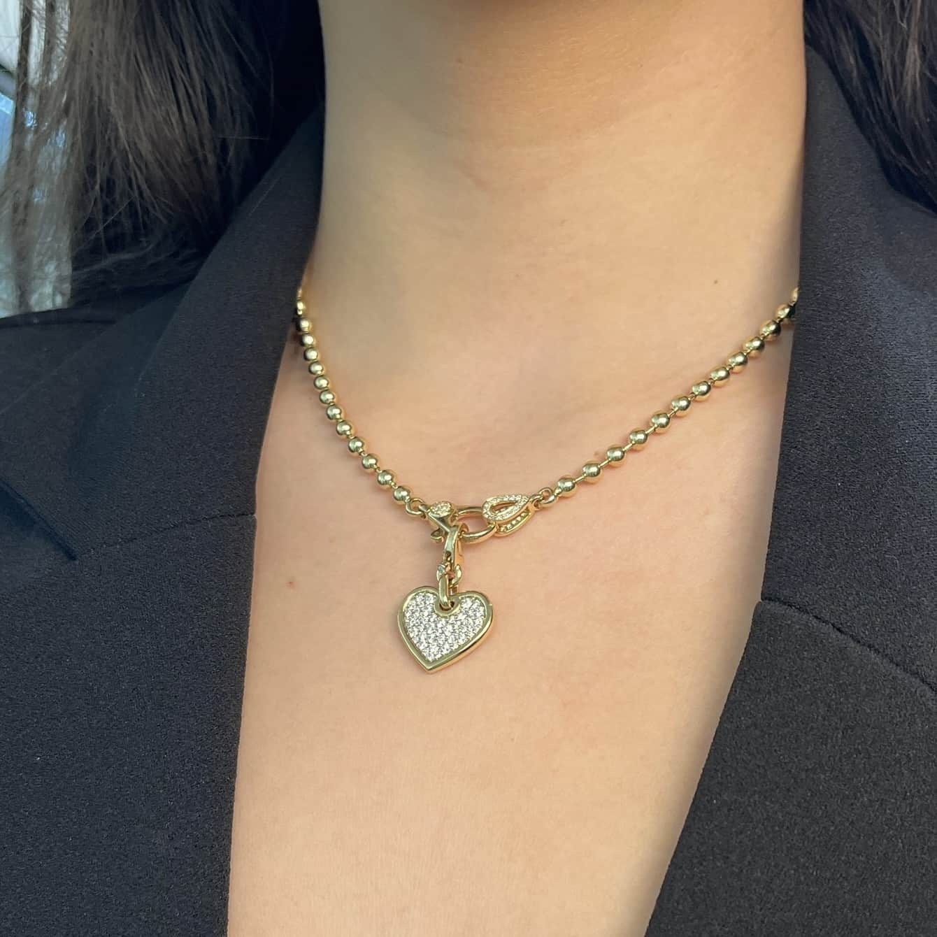 The 3mm Paris Chain from Janet Heller Fine Jewelry is crafted in 14KT gold. The necklace features a beaded chain with a diamond oval pendant and diamond clasp. It's the ideal necklace to showcase a Janet Heller Fine Jewelry charm.