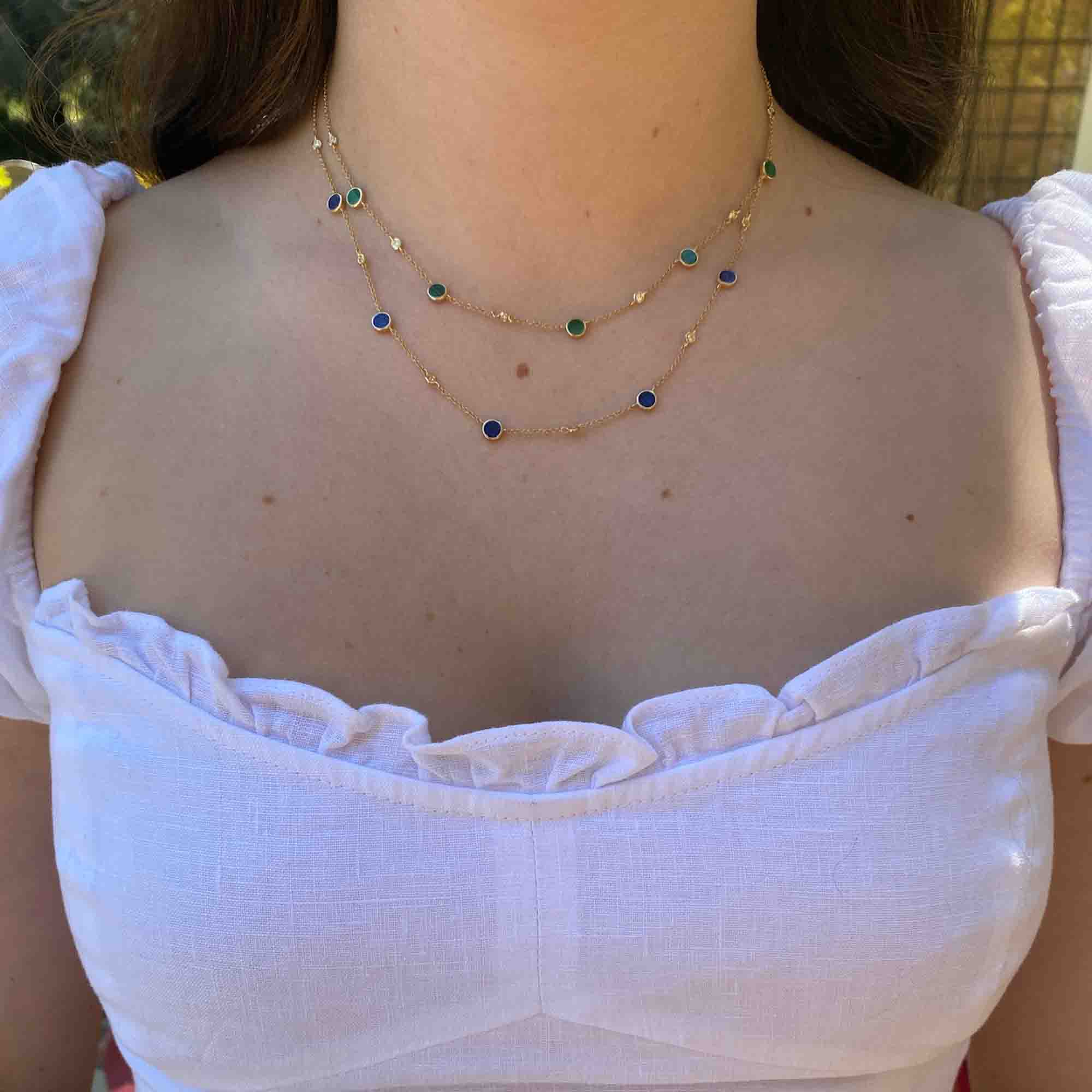 The Lapis Piper Necklace from Janet Heller Fine Jewelry is crafted in 14KT gold.  The delicate chain features alternating lapis and diamond  stones. The necklace can be worn alone or layered with other chains.