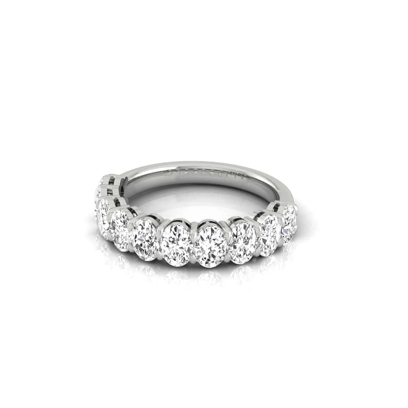 The Half Lab Grown Diamond Eternity Ring is a dazzling silver piece featuring round-cut diamonds set in a continuous row along the band, viewed from the front angle. Custom-made with precision, this exquisite ring is ideal for those who cherish timeless elegance.