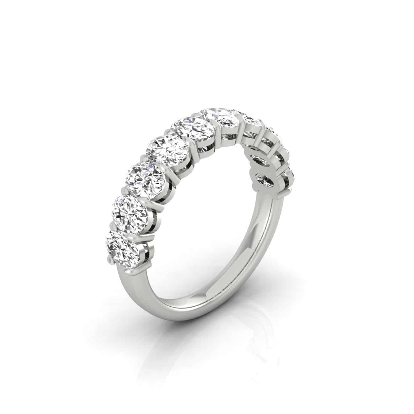 The Half Lab Grown Diamond Eternity Ring features seven round-cut diamonds in a prong setting on a polished silver band, beautifully displayed on a plain white background.