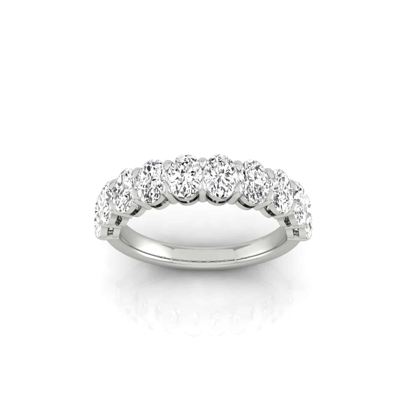 The Half Lab Grown Diamond Eternity Ring features a continuous row of round-cut diamonds set in silver, with elegant 18KT gold accents. Displayed on a plain white background, it highlights its exquisite and luxurious design.
