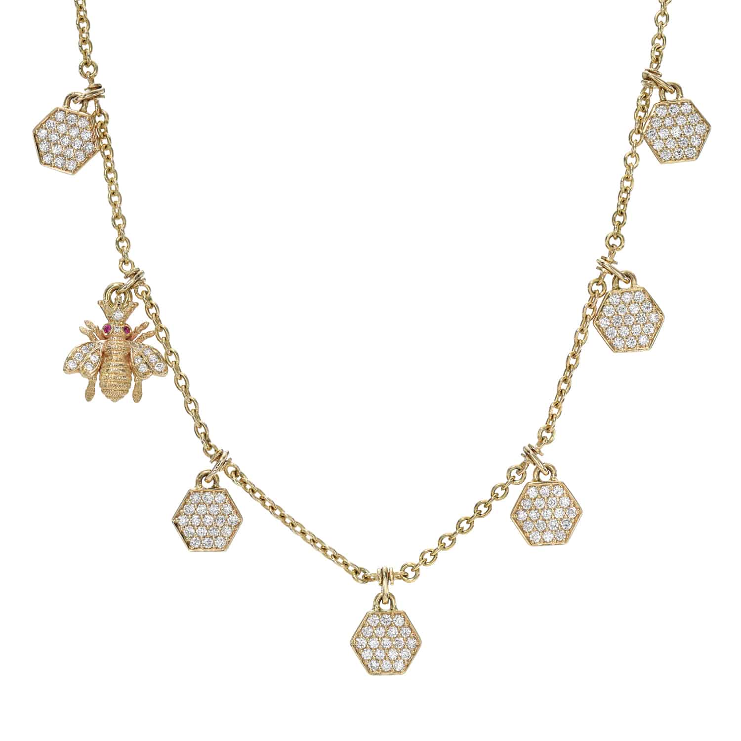Discover the enchanting Honeycomb & Bee Necklace by Janet Heller Fine Jewelry, featuring a bee charm, hexagonal honeycomb-inspired pieces, and sparkling white gemstones on a delicate gold-toned chain for an elegant touch.