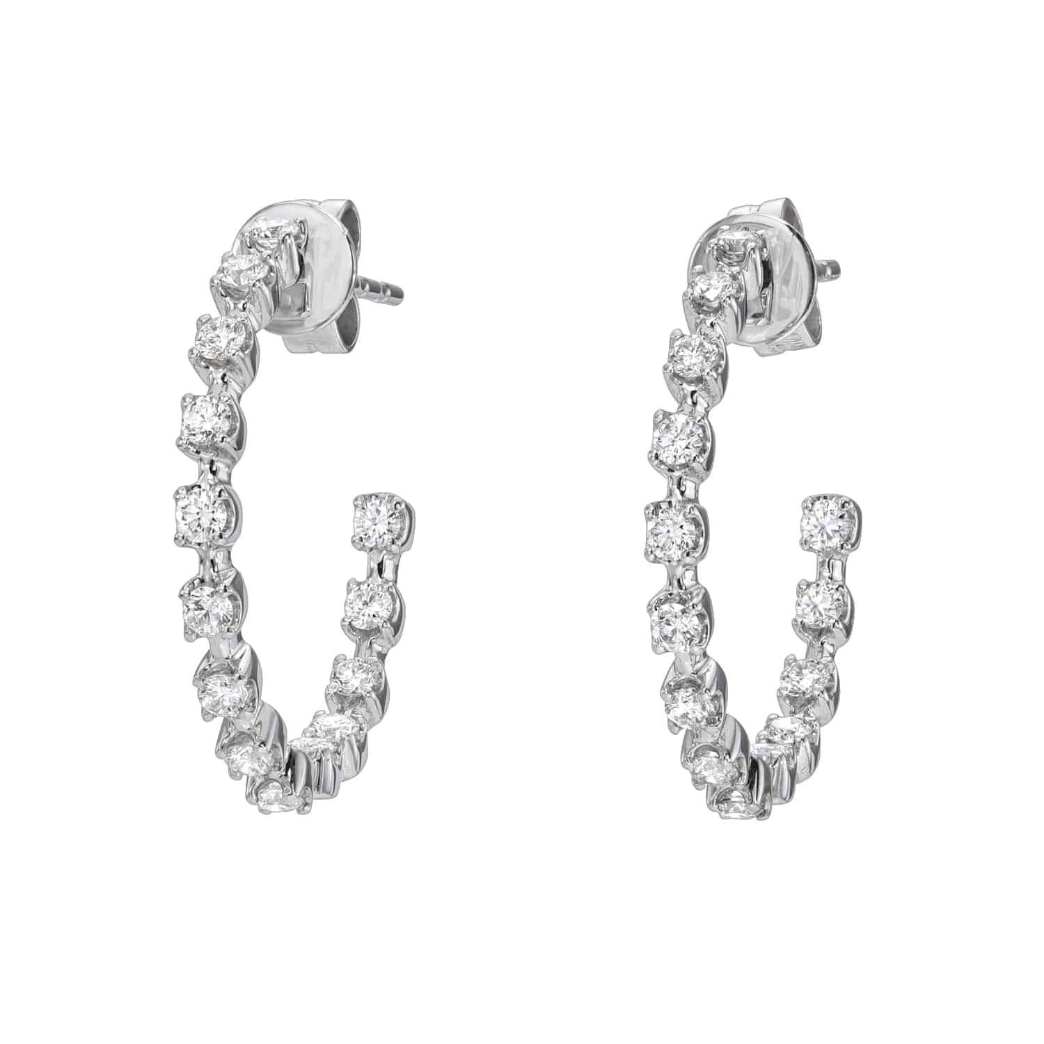 The Scalloped Diamond Hoop Earrings from Janet Heller Fine Jewelry are crafted in 14KT white gold and feature 28 evenly spaced diamonds.