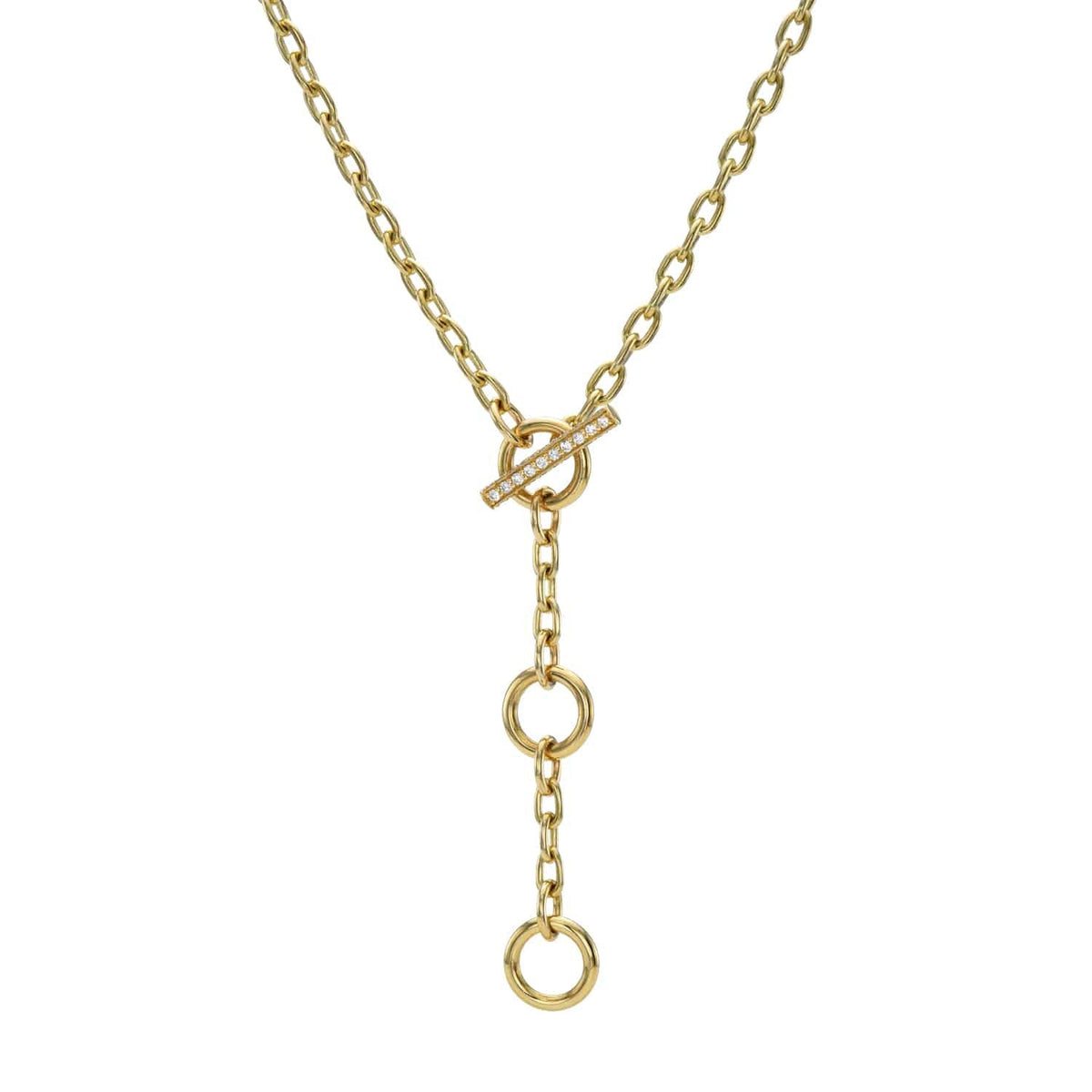 Experience the elegance of Janet Heller Fine Jewelry with the London Chain necklace. It features a gold chain with a vertical drop, three circular links, and is secured by a stylish bar-and-ring toggle clasp. This modern yet timeless design is perfect for showcasing your style.