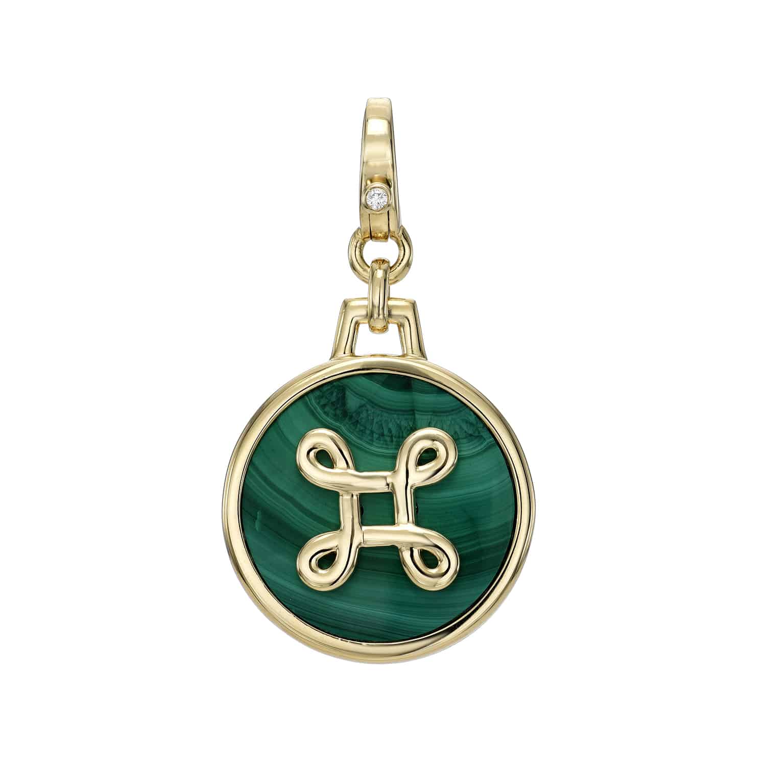 Explore the Malachite Round Love Knot Charm by Janet Heller Fine Jewelry, showcasing a captivating green malachite stone embedded in a gold pendant, adorned with mirrored spiral symbols. A small diamond embellishes the clasp, offering exquisite elegance and sparkle.