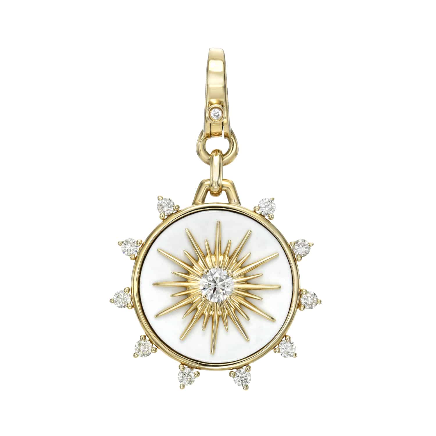 The Diamond & Cacholong Bentley Charm from Janet Heller Fine Jewelry is a gold circular pendant with a sunburst design. It features small gemstones and a central gemstone, a diamond-accented gold loop, and offers unique customizations for style.