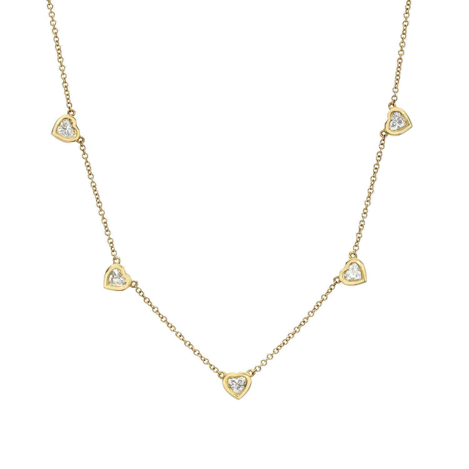 The Heart-Shaped Diamond Station Necklace features an elegant design with five symmetrically positioned heart-shaped pendants, each set with a sparkling gem, along a delicate gold chain.