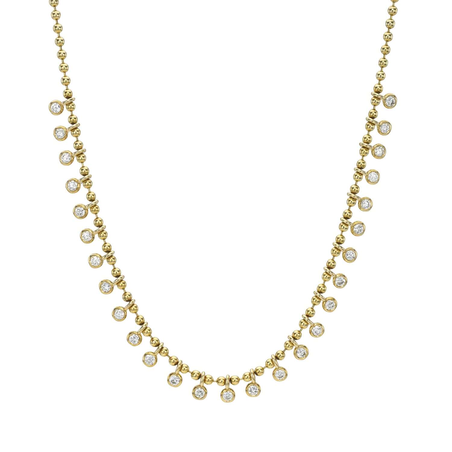The Diamond Eisley Necklace from Janet Heller Fine Jewelry is crafted in 14KT gold.  It features a chain of gold beads with dangling round diamonds.  The necklace can be worn on its own or layered with other necklaces.
