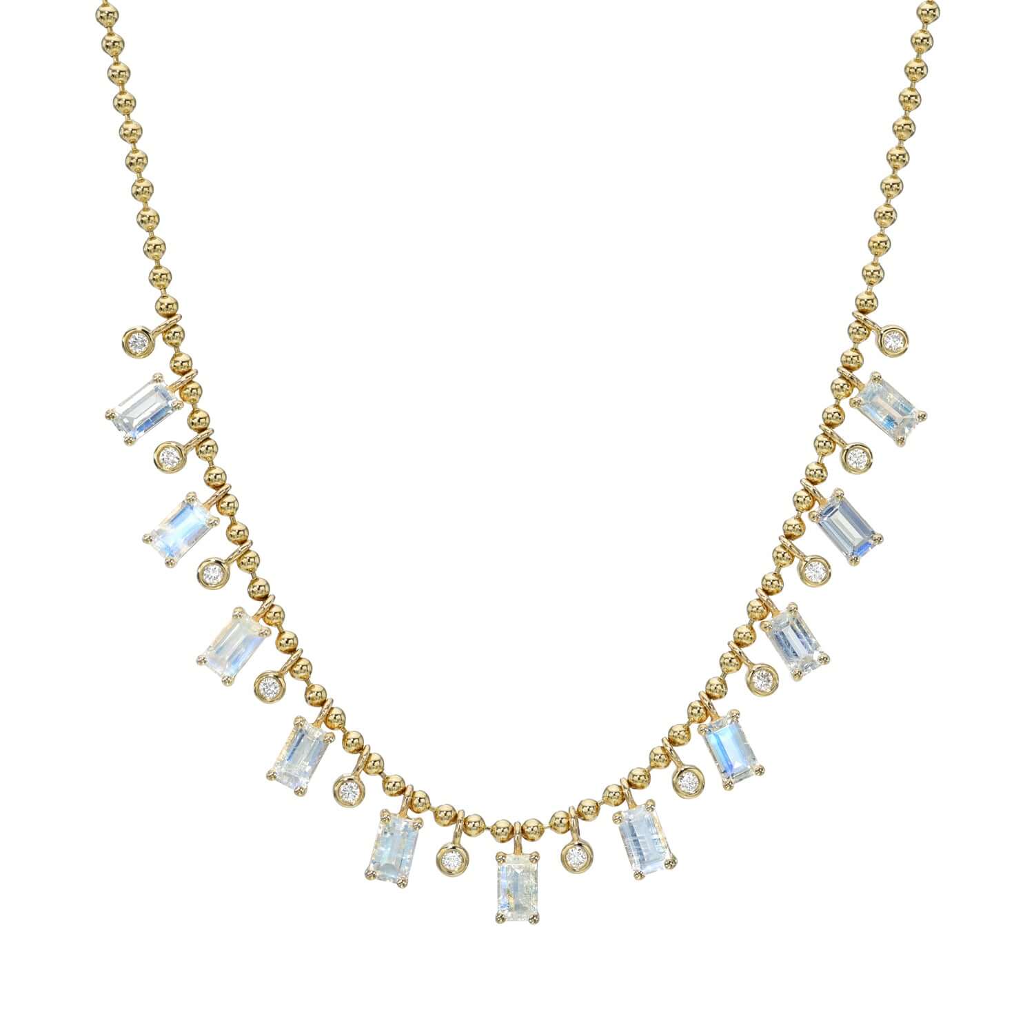 The Beaded Bezel & Moonstone Diamond Necklace from Janet Heller Fine Jewelry is crafted in 14KT gold. It features emerald-cut moonstone pendants and round dangling diamonds. The necklace can be worn on its own or layered with other chains.