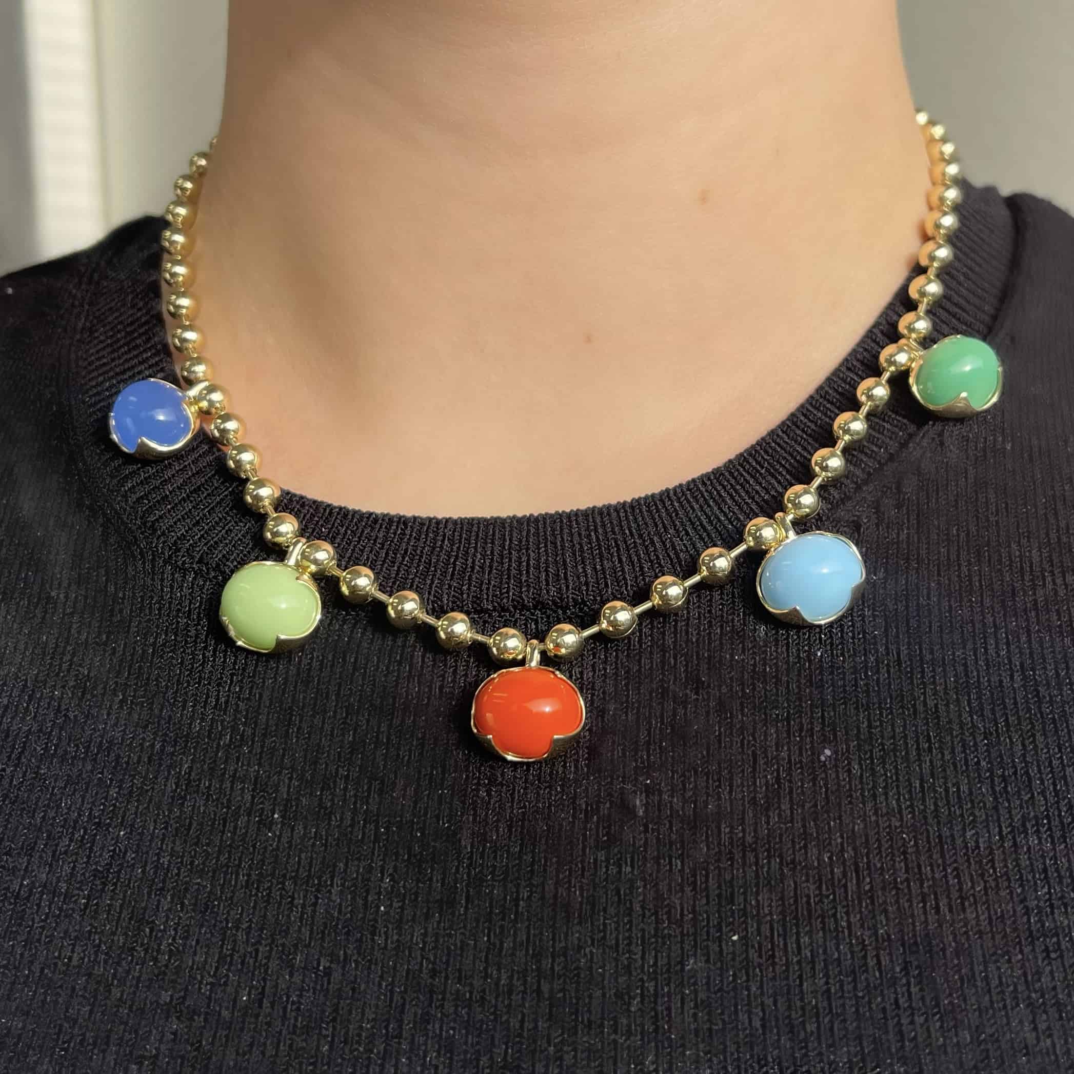 The Mixed Colored Stone Necklace from Janet Heller Fine Jewelry is crafted in 14KT gold. The necklaces features gold beads and colorful round pendants in blue, orange, green, light green and light blue.